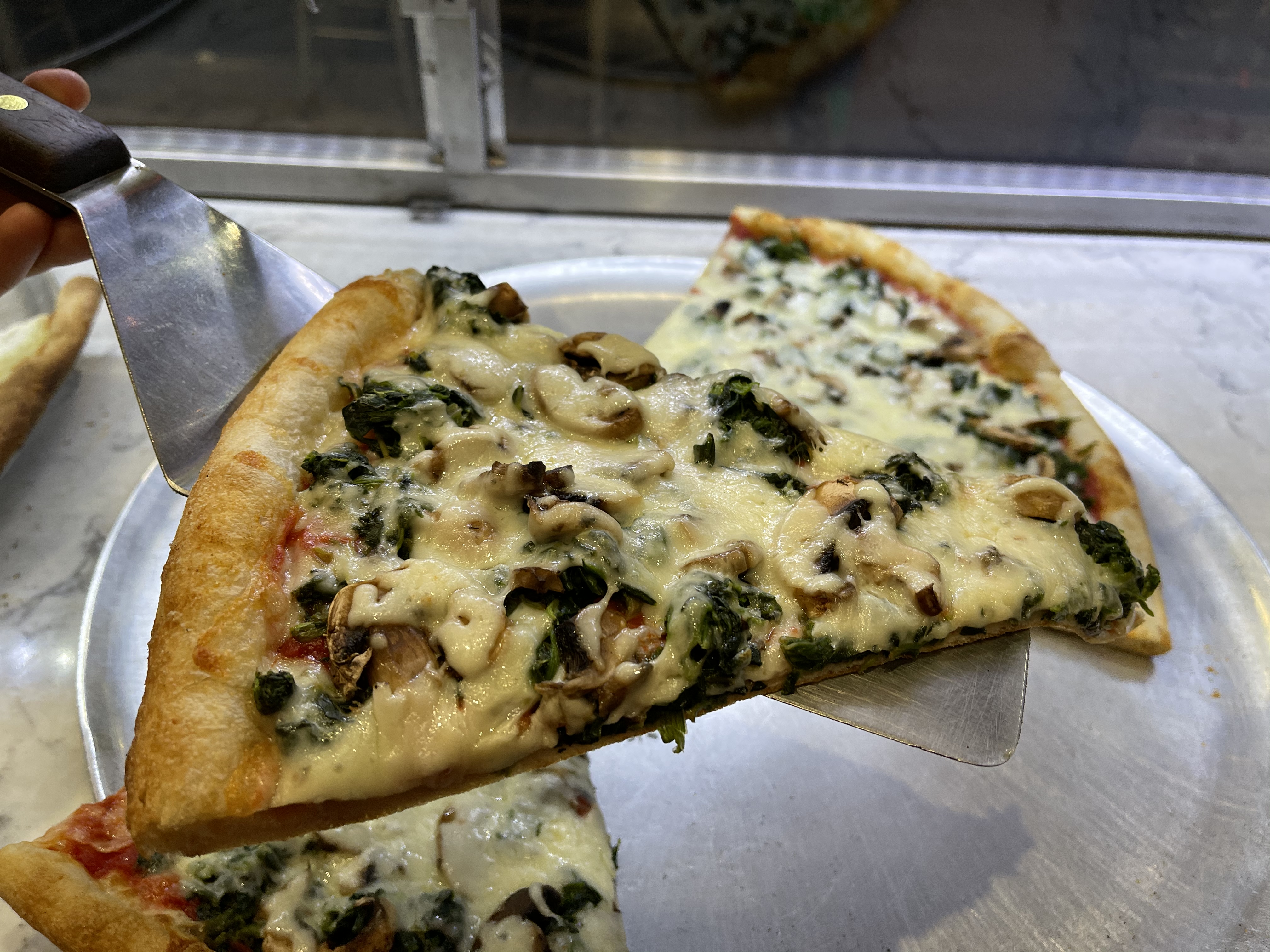 Order Spinach and Mushroom Pizza Slice food online from Famous famiglia pizza store, New York on bringmethat.com