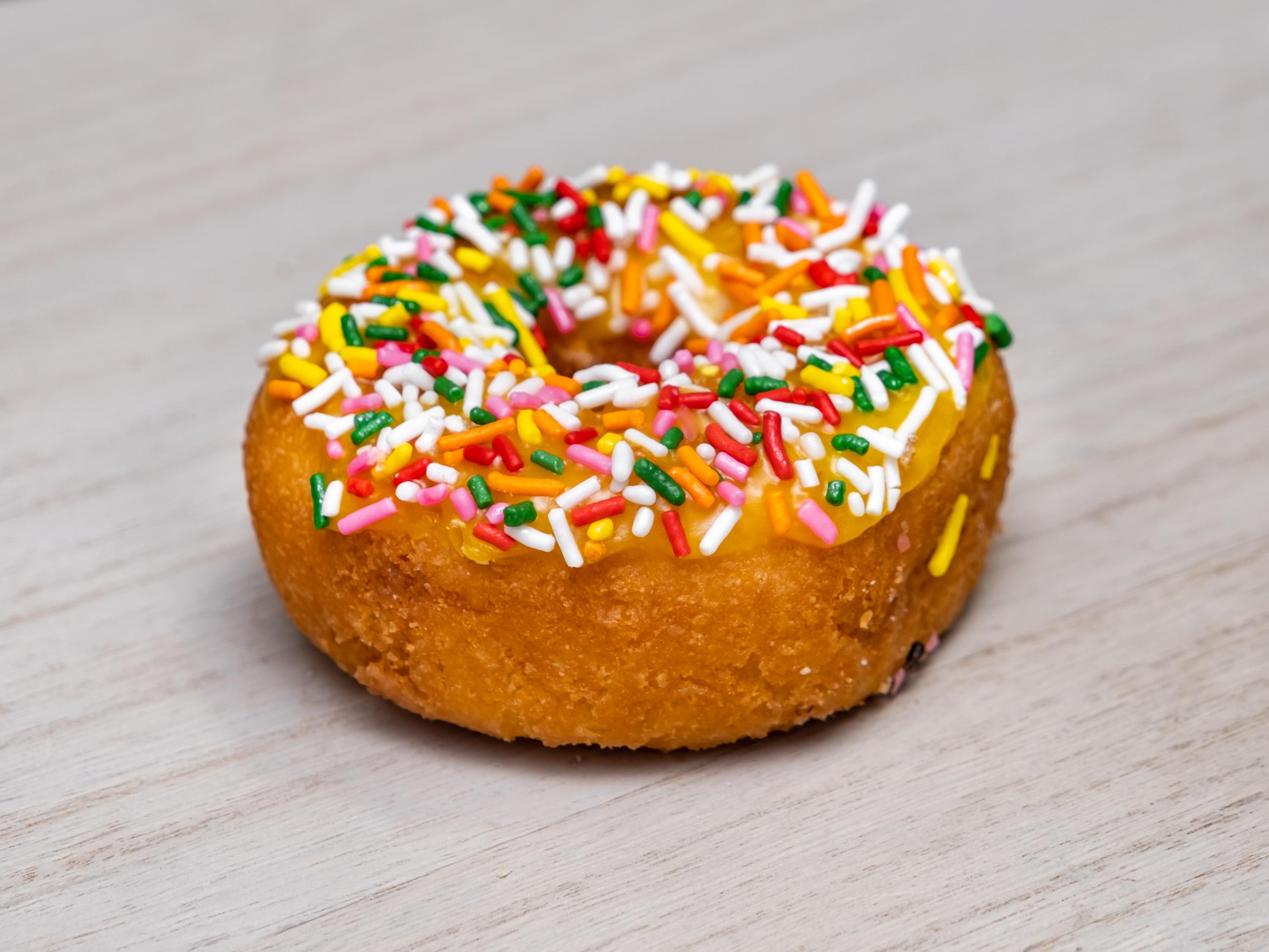 Order Rainbow Sprinkle Orange Cake food online from Banning Donuts store, Banning on bringmethat.com