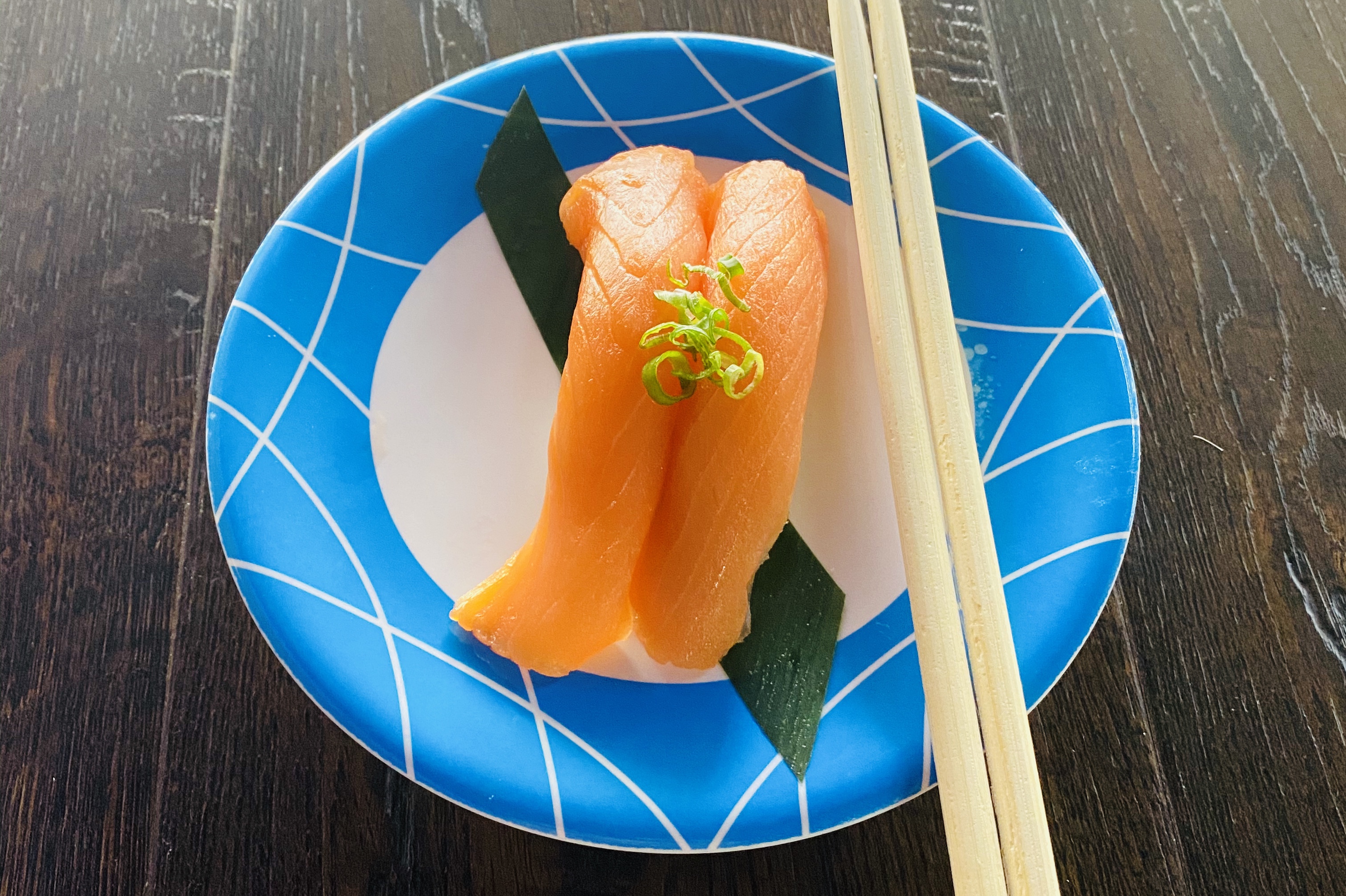 Order Smoke Salmon Nigiri - 2 Pieces food online from Sushi Train store, Minneapolis on bringmethat.com