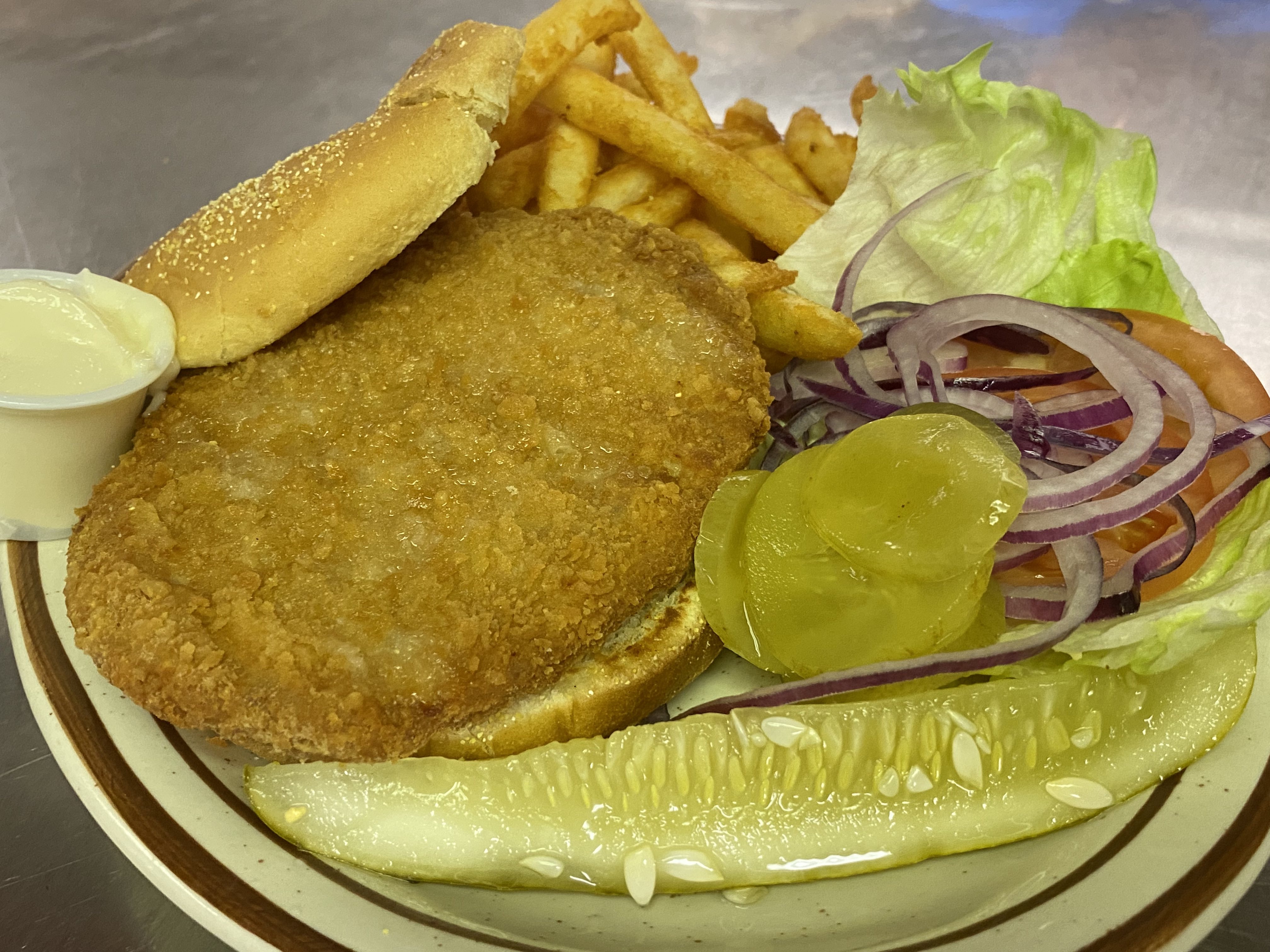 Order Breaded Pork Tenderloin Sandwich with French Fries  food online from Carver Family Restaurant store, Richmond on bringmethat.com