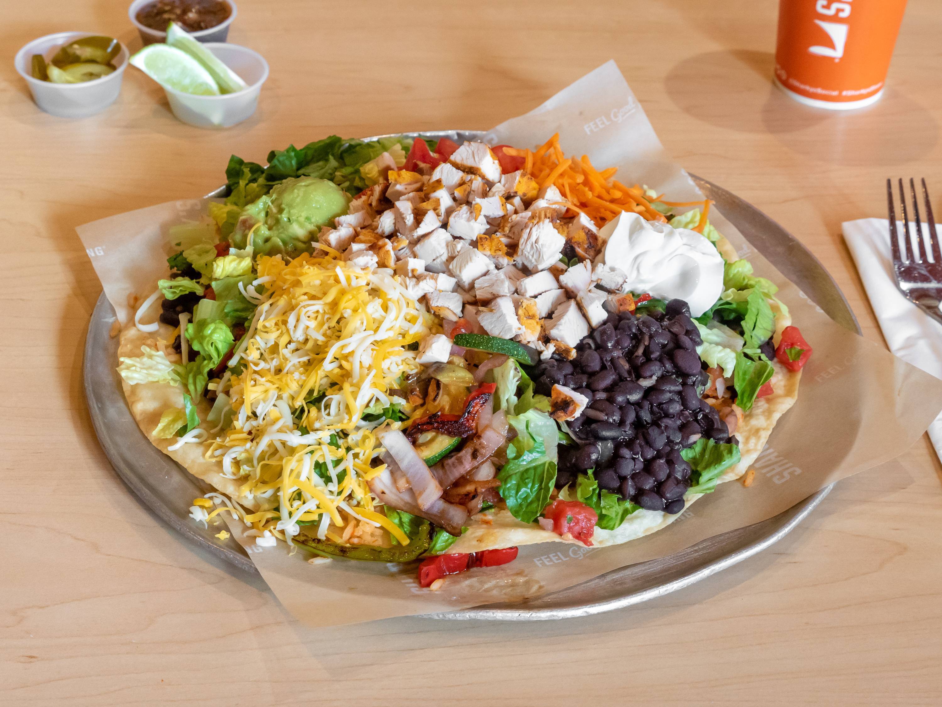 Order Tostada Salad food online from Sharkys Woodfire Mexican Grill store, North Hollywood on bringmethat.com
