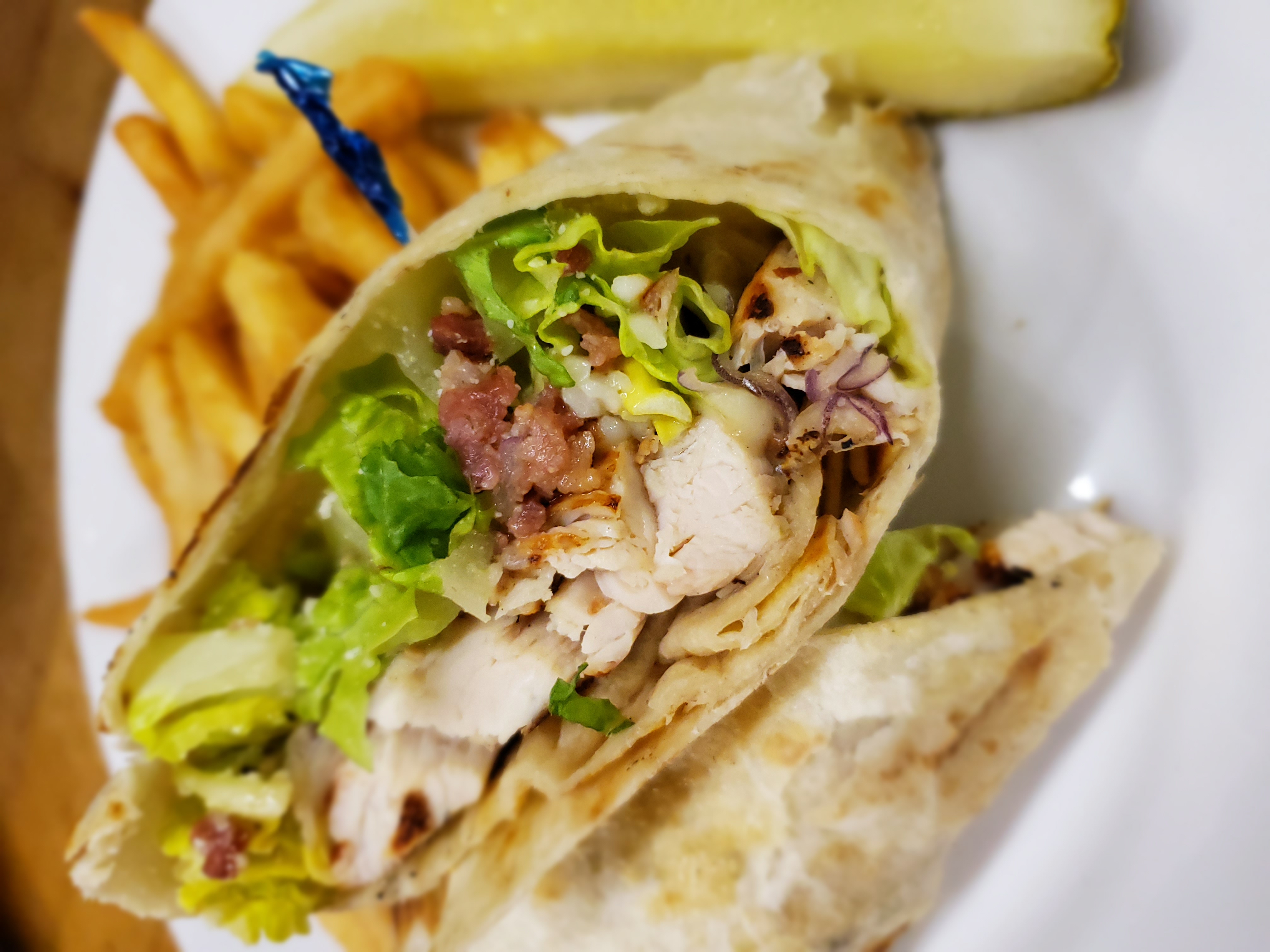 Order Chicken Caesar Wrap food online from Pineapple Jacks store, Rochester on bringmethat.com