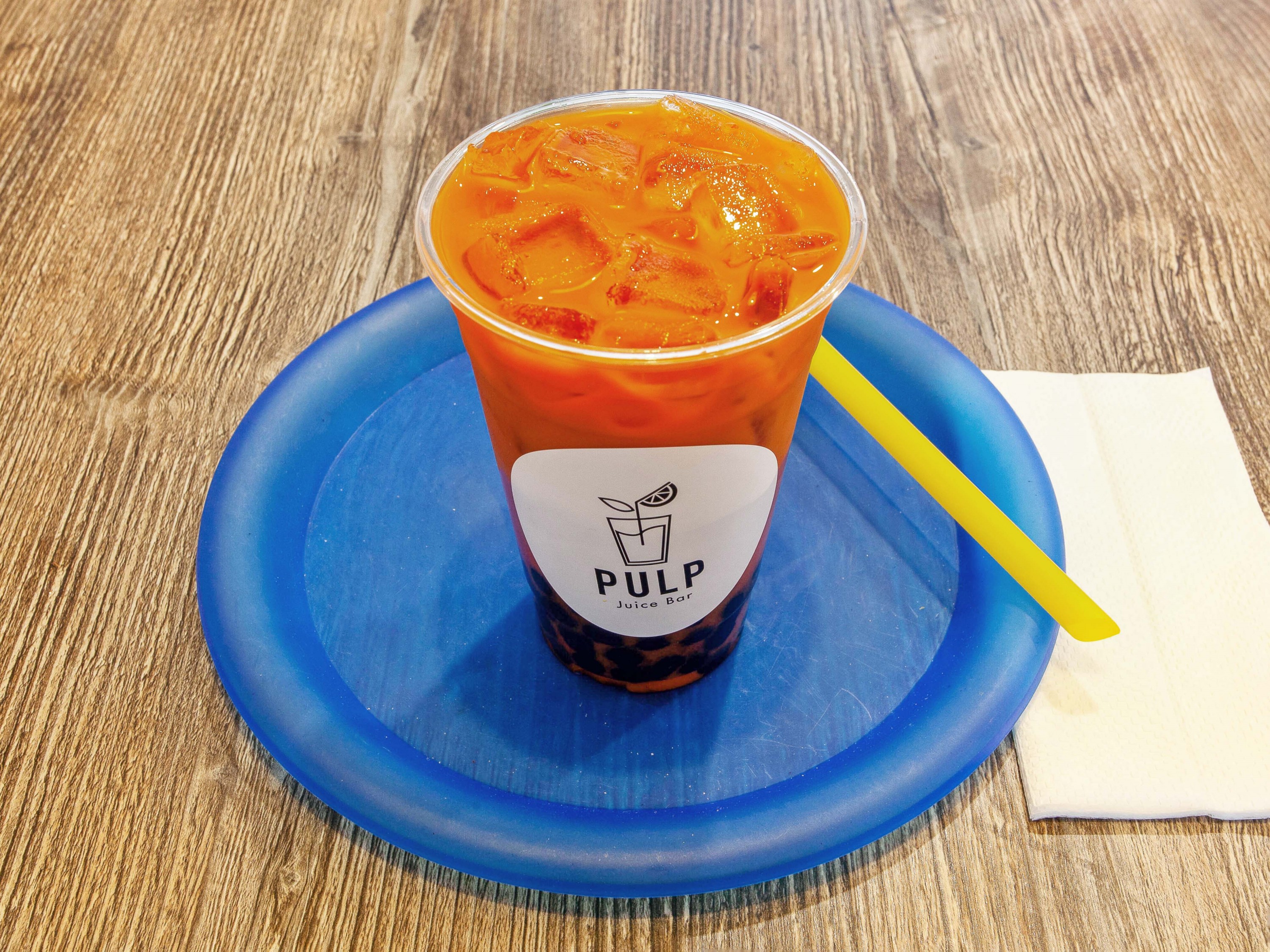 Order  Thai Tea food online from Pulp Juice Bar store, Orange on bringmethat.com