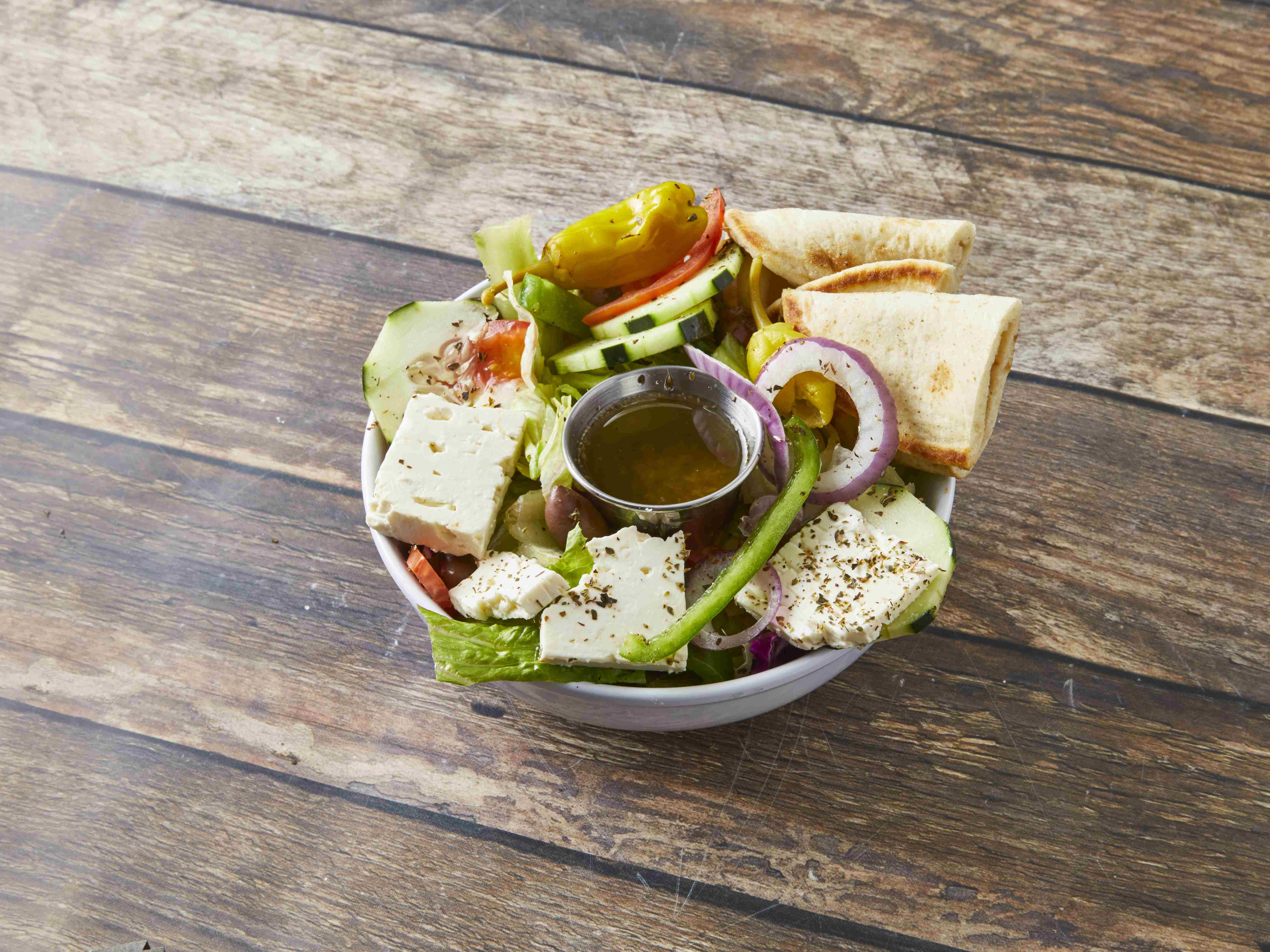 Order Greek Salad food online from Tom & Jerry's Gyros store, Chicago on bringmethat.com