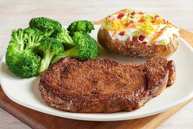 Order Ribeye* food online from Outback Steakhouse store, Commerce on bringmethat.com