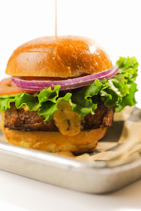 Order Veggie Burger (V) food online from Cafe Saint-Ex store, Washington on bringmethat.com