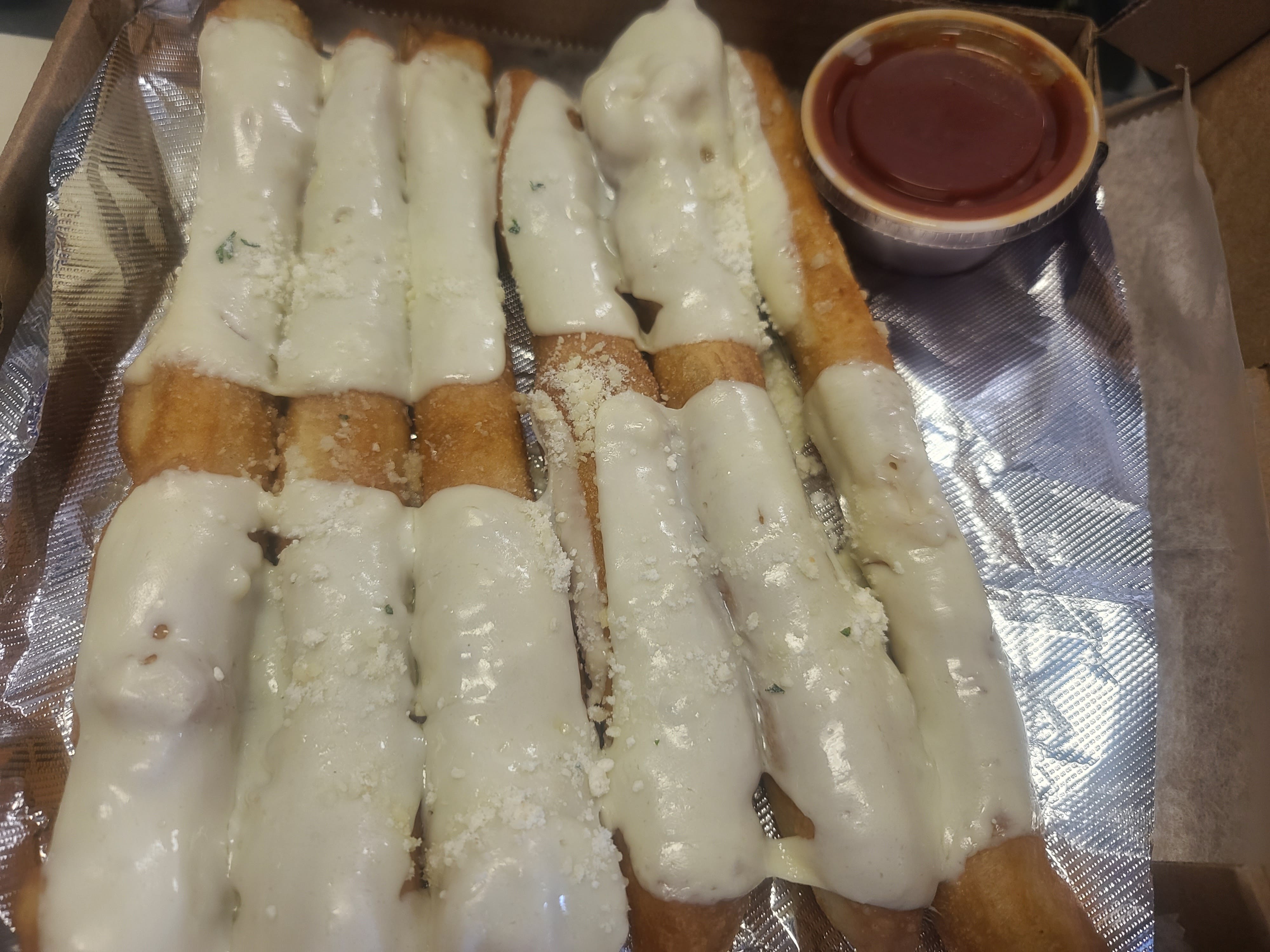 Order Bread Sticks with Cheese - Appetizer food online from Brother Pizza Pasta & Sub store, Harrisonburg on bringmethat.com