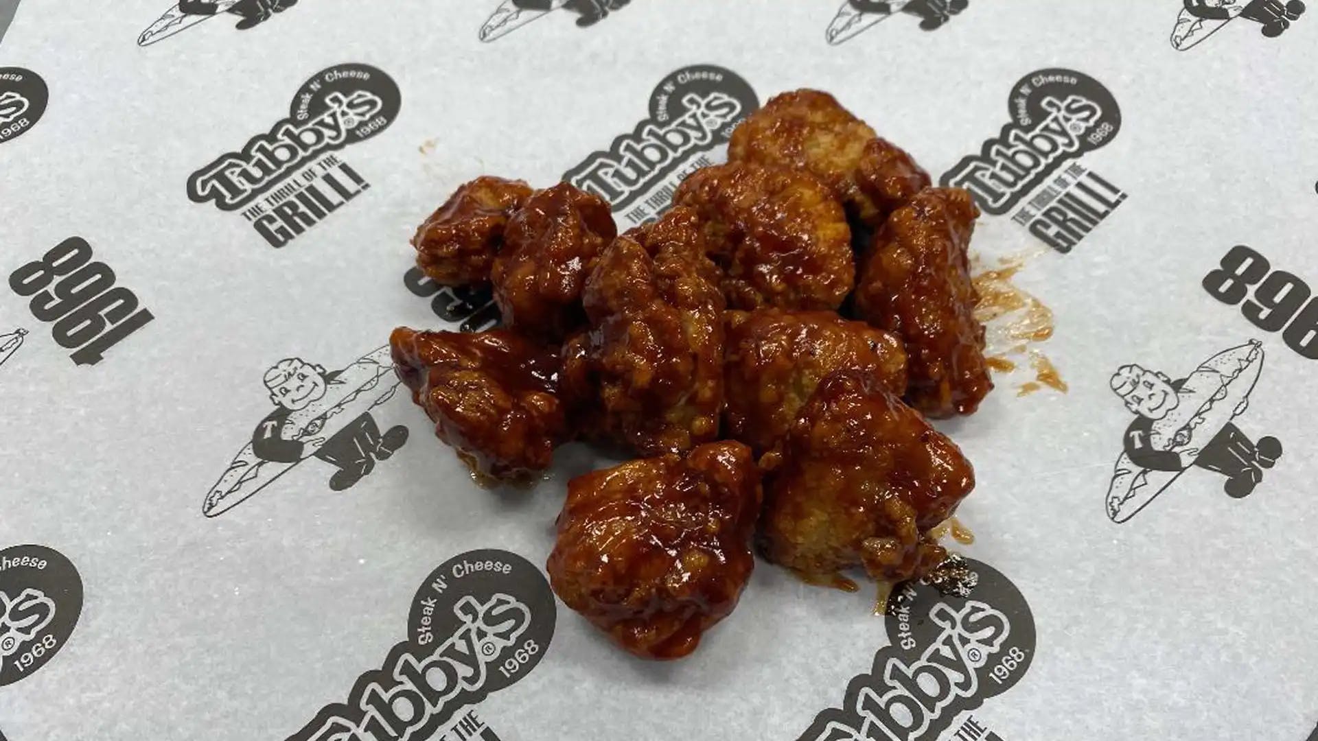 Order Boneless Chicken Wings - 1/2 lb. food online from Tubby's Grilled Submarines store, Westland on bringmethat.com