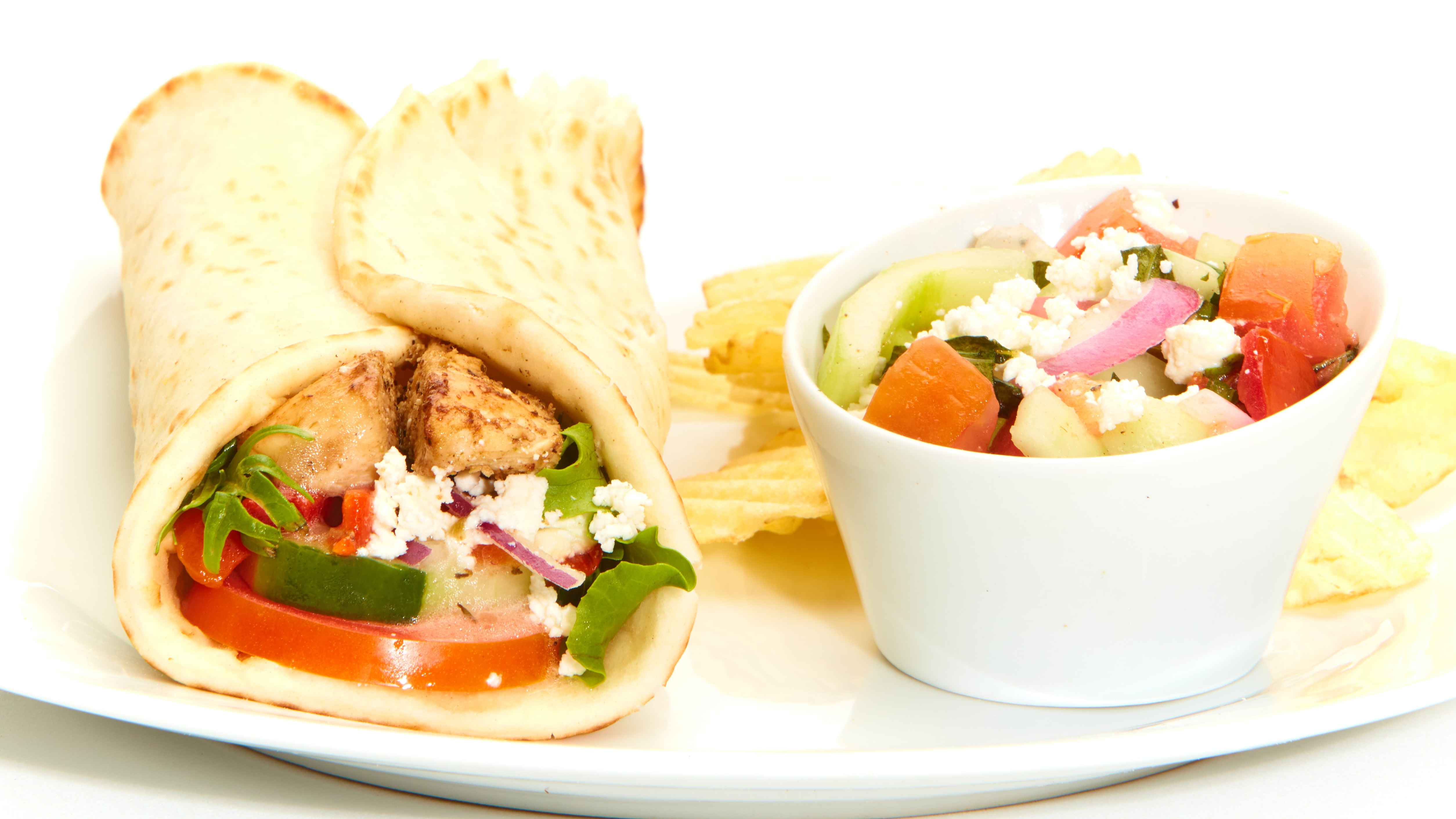 Order Greek Salad Gyro with Chicken food online from Taziki’s Mediterranean Cafe store, Opelika on bringmethat.com
