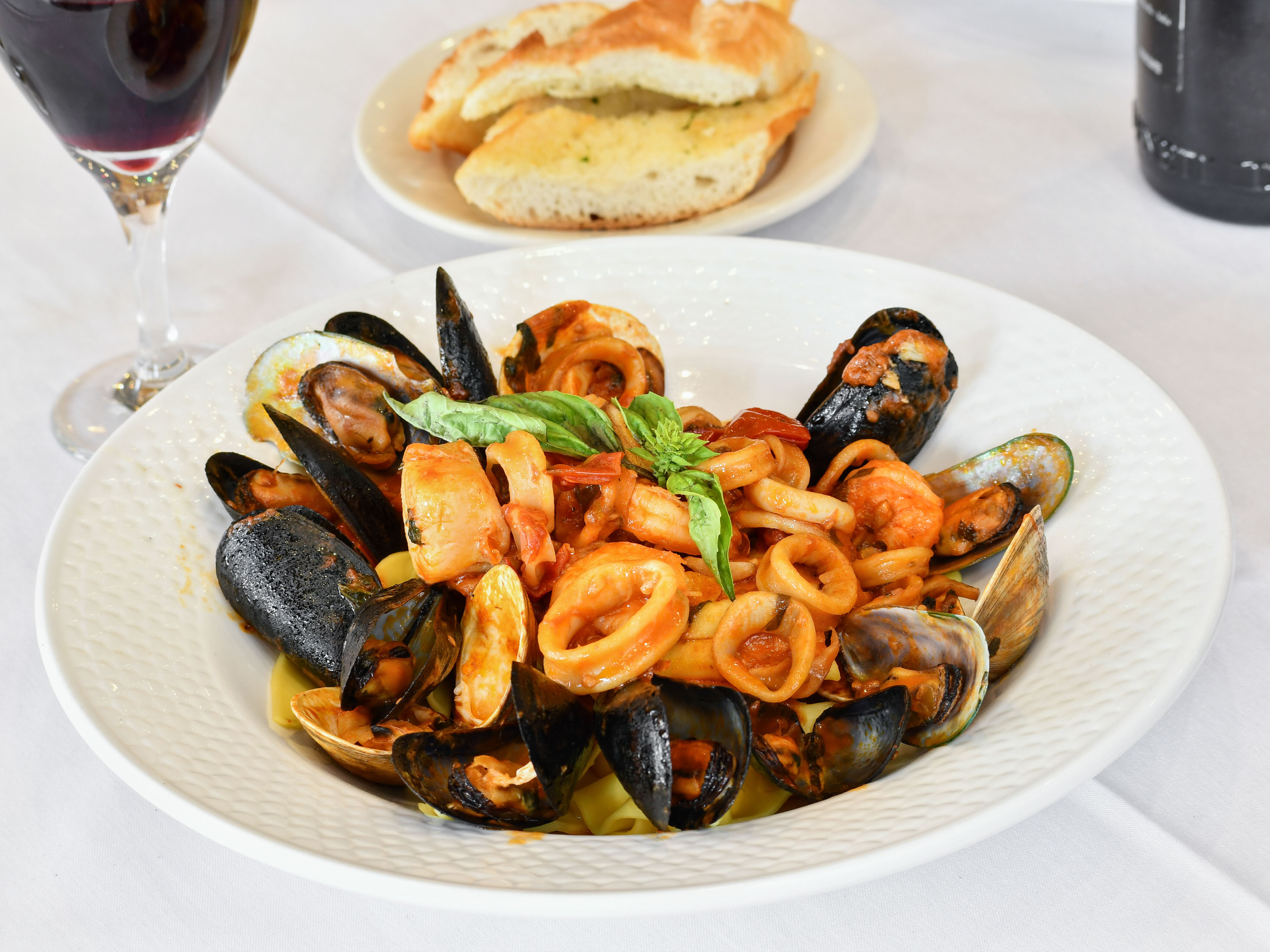 Order Black Linguini di Mare food online from Portofino Ristorante store, Forest Hills on bringmethat.com