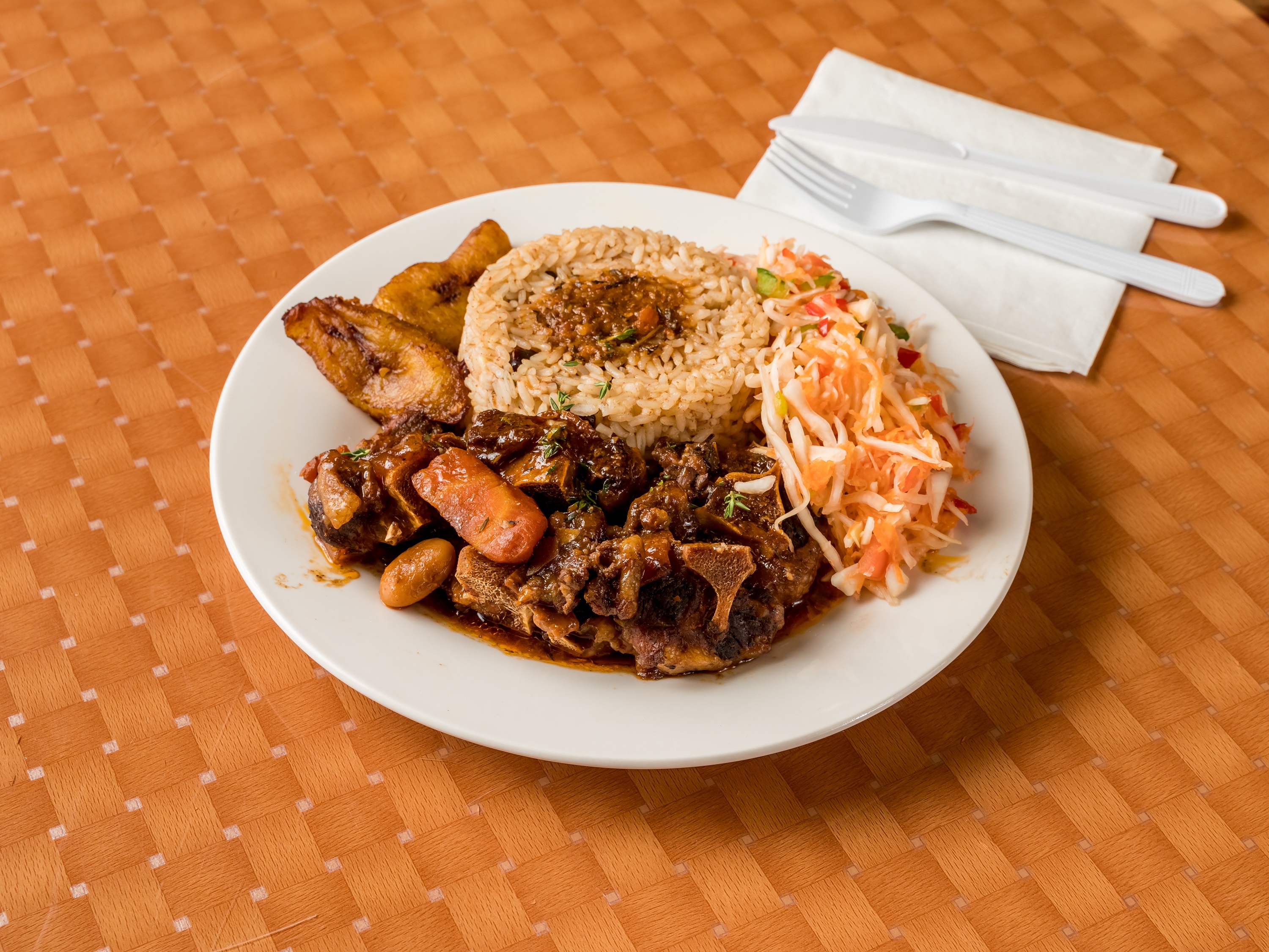 Order Oxtail Meal food online from Caribbean Spot store, Coram on bringmethat.com