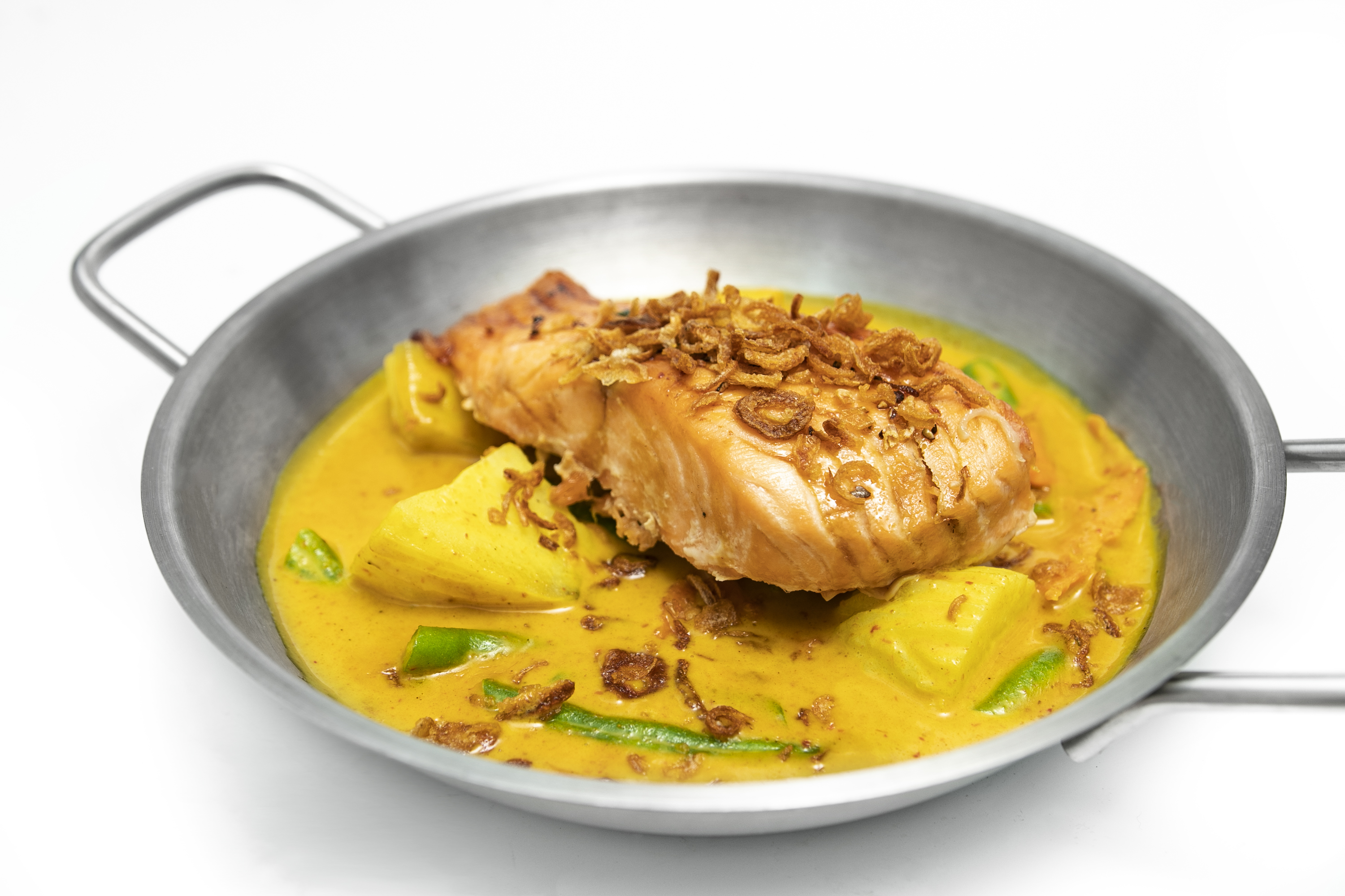 Order K3. Atlantic Salmon (Yellow Curry) food online from SUROSS Thai Bistro store, New York on bringmethat.com