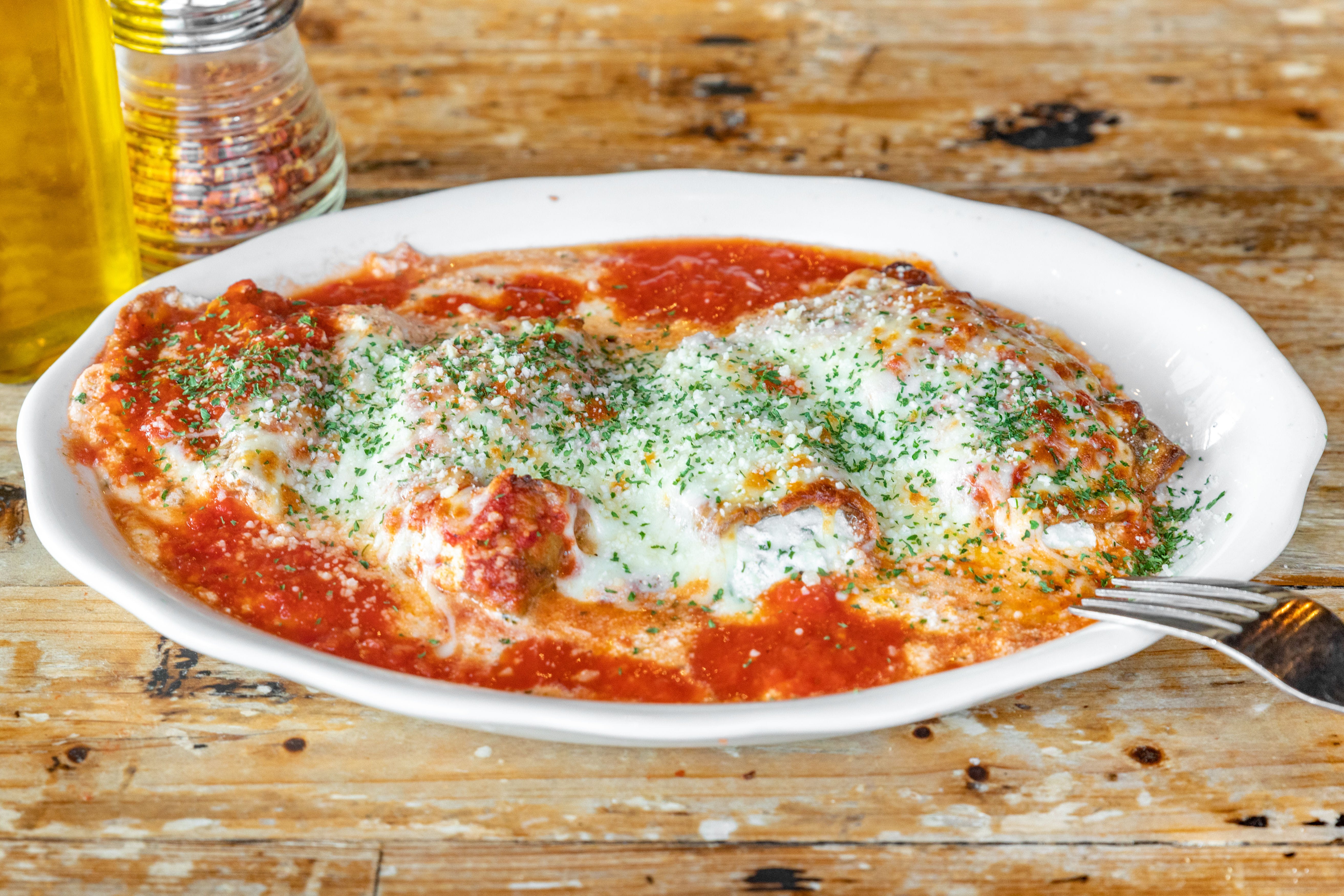 Order Eggplant Parmigiana - Entree food online from Trumbull Pizza Co store, Trumbull on bringmethat.com