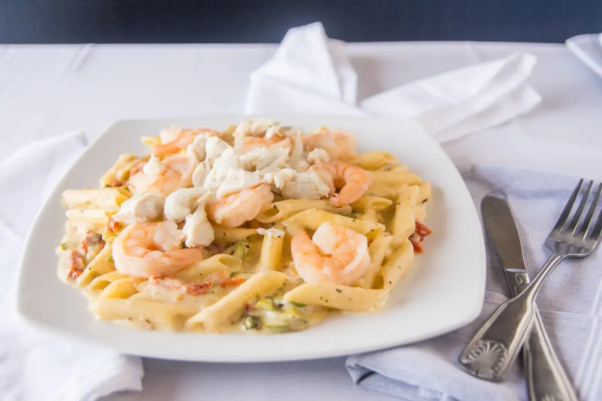 Order Shrimp & Crab Penne food online from The Olive Branch Italian Grill store, Reisterstown on bringmethat.com