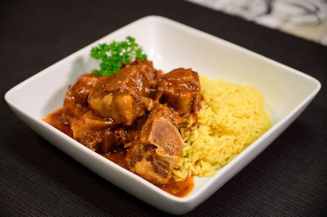 Order Oxtail Over Rice food online from Who's Got Soul Southern Cafe store, Decatur on bringmethat.com