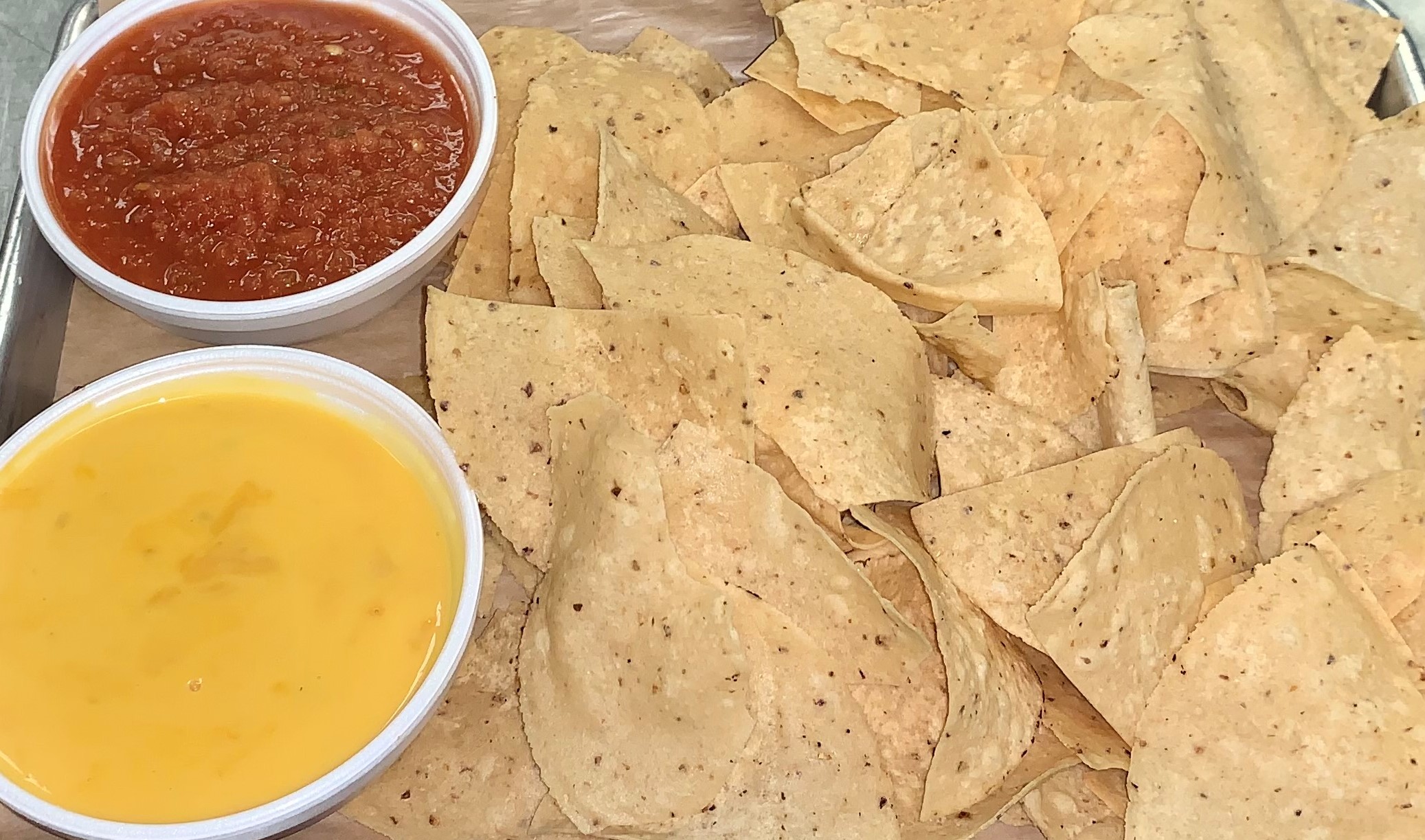 Order Chips and Salsa with Queso  food online from Coach Smoke store, Waco on bringmethat.com