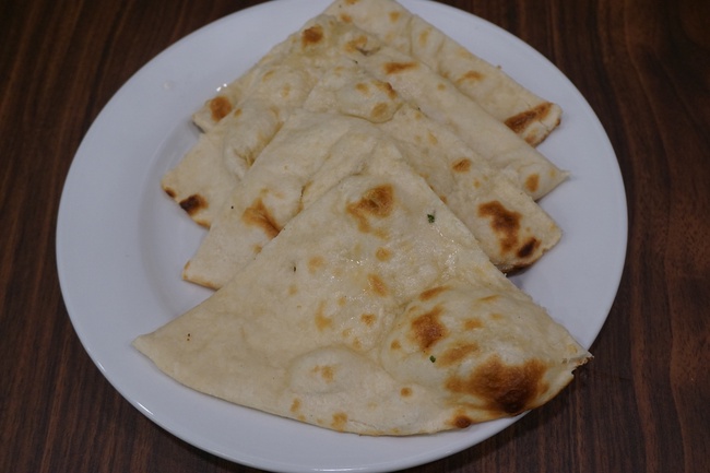 Order Plain Naan. food online from The Madras Cafe store, Aurora on bringmethat.com