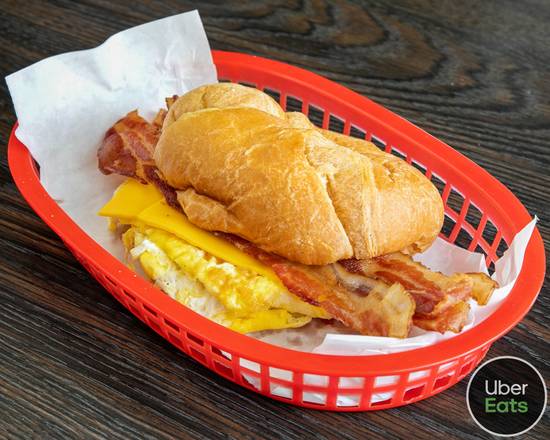 Order Sandwich Bacon And Egg Cheese Croissant Roll food online from Ozzies donut store, Lake Dallas on bringmethat.com