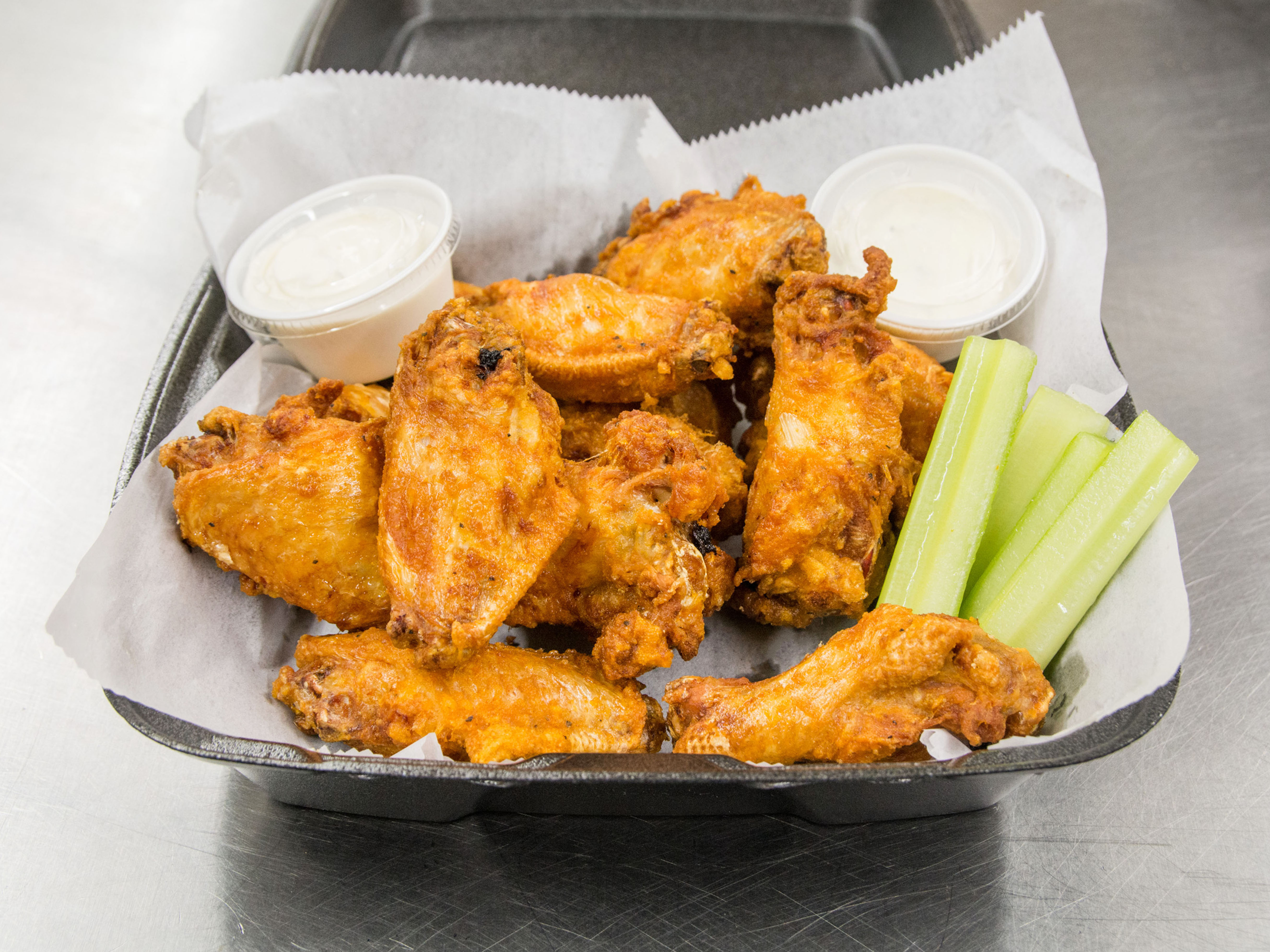 Order Jumbo Party Wings food online from Caton Pizza & Subs store, Baltimore on bringmethat.com