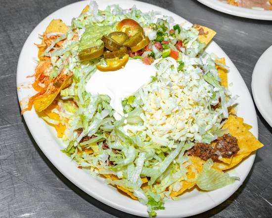 Order Fajitas Nachos Supreme food online from El Vaquero Mexican Restaurant store, Huntsville on bringmethat.com