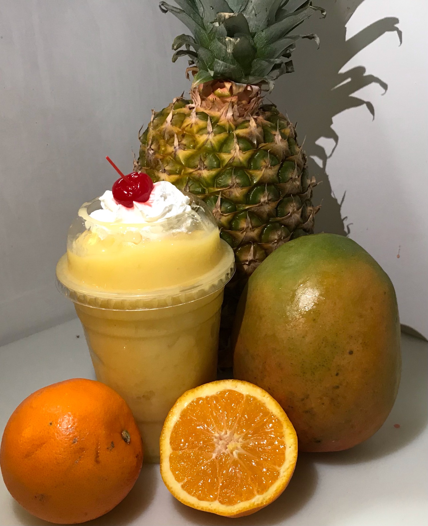 Order #7 Mango, Pineapple, Orange smoothie  food online from El Papayon store, Ontario on bringmethat.com