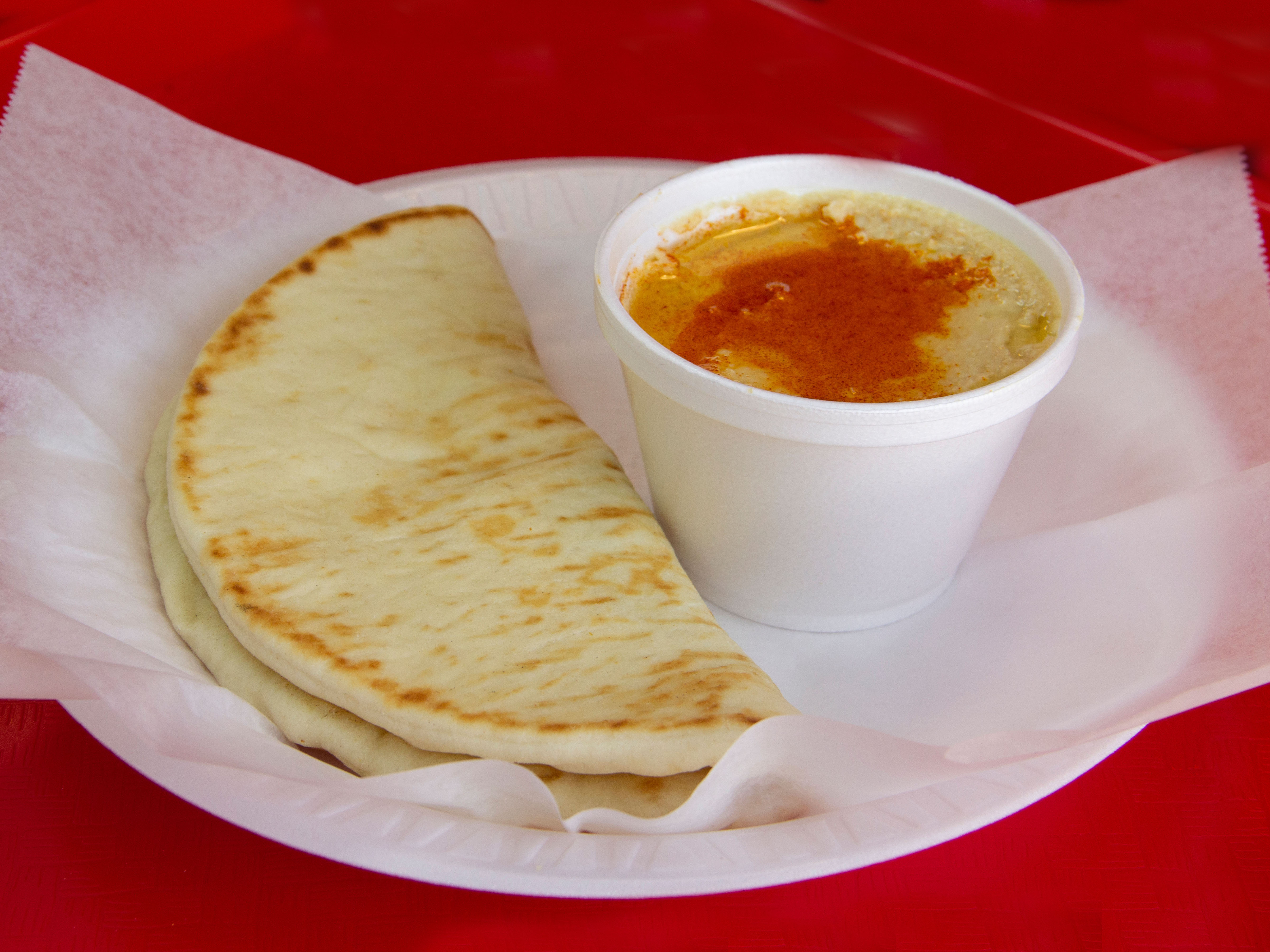 Order Hummus ( includes one pita) food online from Gyro Hut store, Houston on bringmethat.com