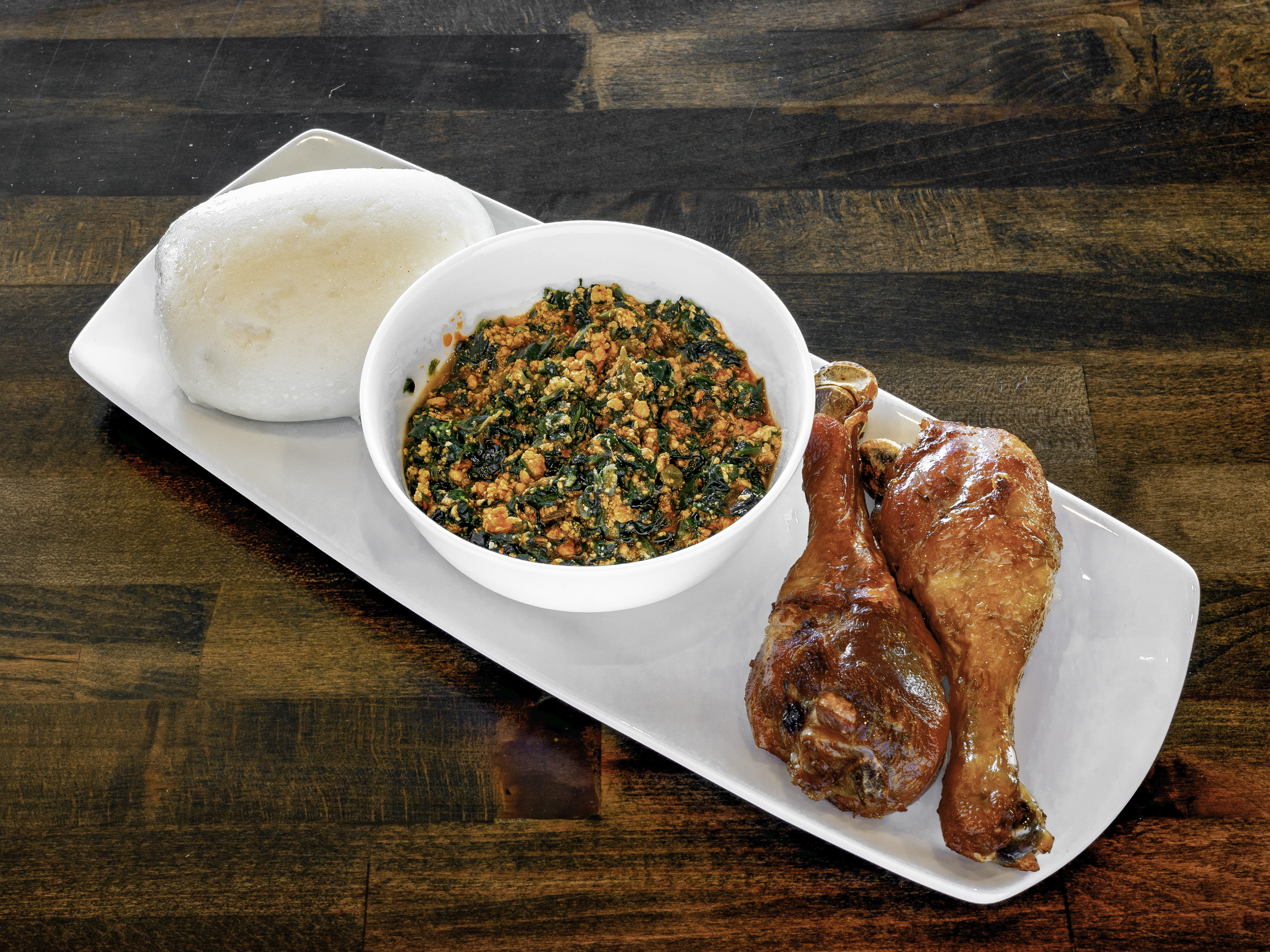 Order Egusi Plate food online from Chobas African Kitchen & Bakery store, Waldorf on bringmethat.com