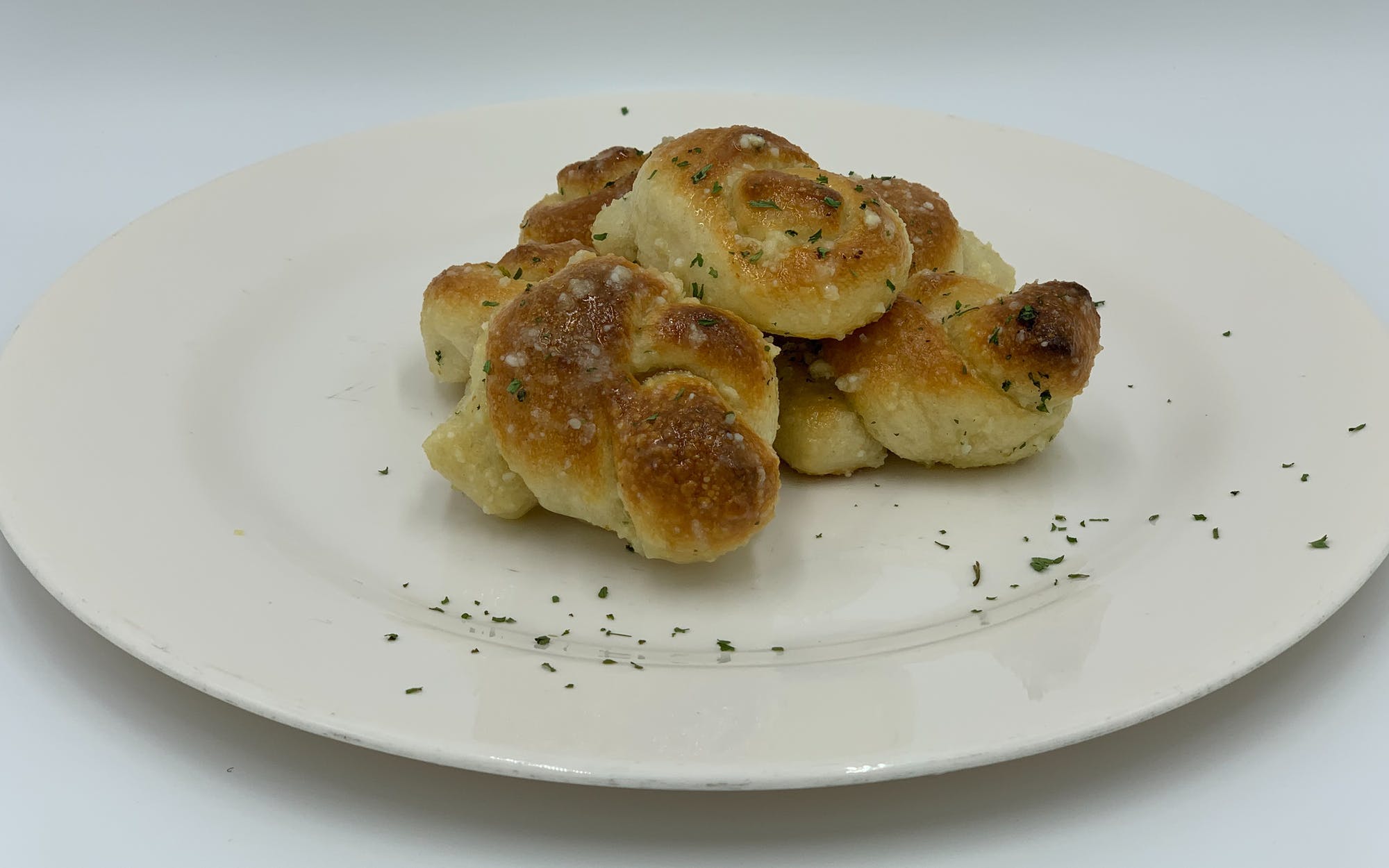 Order Garlic Knots - 6 Pieces food online from Mario Pizza store, Westbury on bringmethat.com