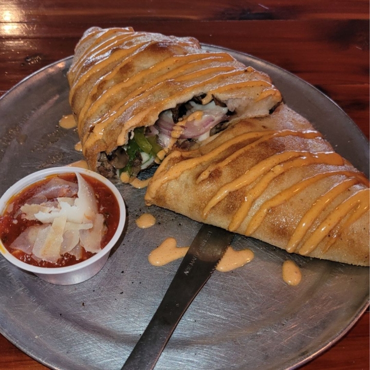 Order Ground Philly Calzone food online from Neighbor Kitchen & Yard store, Bastrop on bringmethat.com