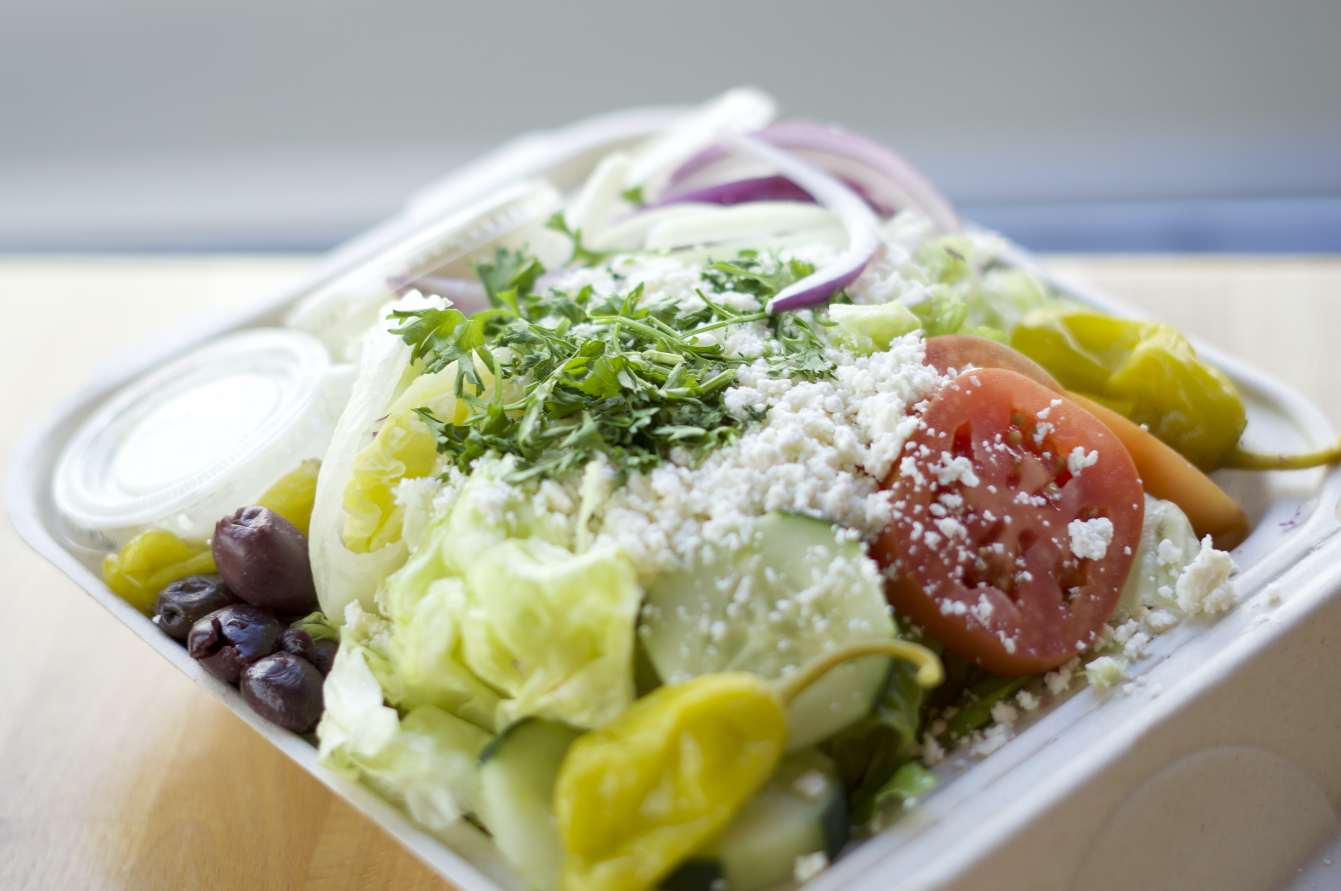 Order Greek Salad food online from Romio's Pizza store, King County on bringmethat.com
