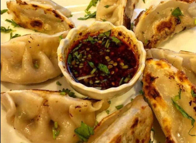 Order A10. Pot Stickers food online from Dragon Palace Chinese Restaurant store, Davenport on bringmethat.com
