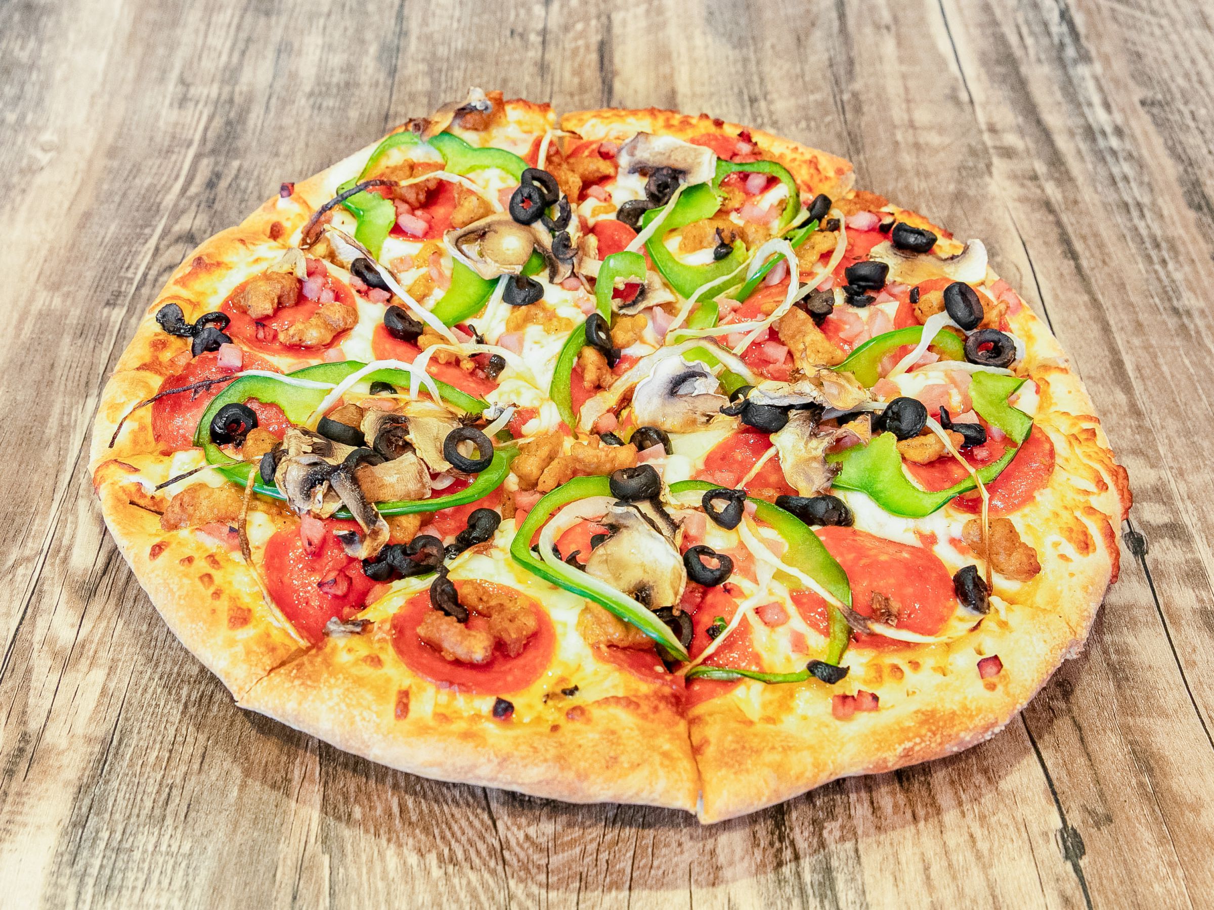 Order Veggie and Meat Supreme Pizza food online from Cutting Edge Pizza & Wings store, Atlanta on bringmethat.com