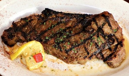 Order 12 oz. New York Strip food online from Chad Anthony's Italian Grille store, Youngstown on bringmethat.com
