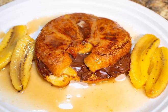 Order Croissant French Toast Stuffed with Nutella and Banana Foster food online from Dannys' Deli store, Patchogue on bringmethat.com