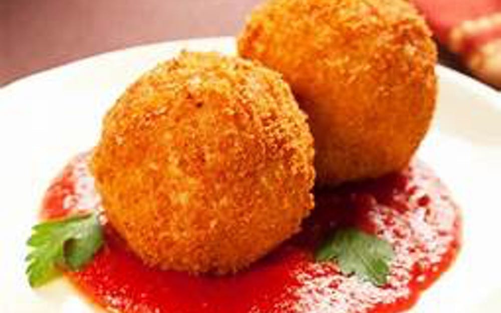 Order Rice Ball - Appetizer food online from Pino's Pizzeria store, Easton on bringmethat.com