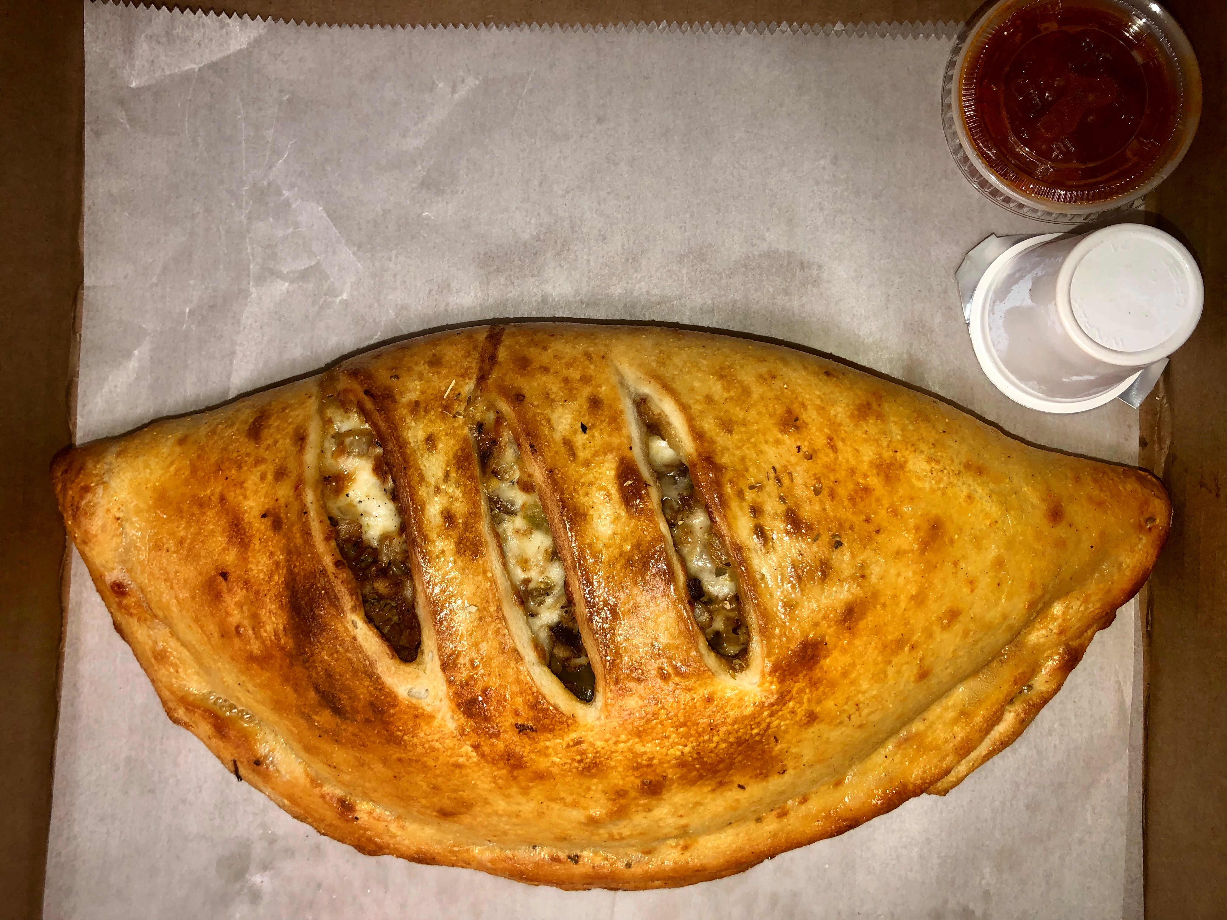 Order Chicken steak calzone  food online from Mikie's pizza store, Baltimore on bringmethat.com