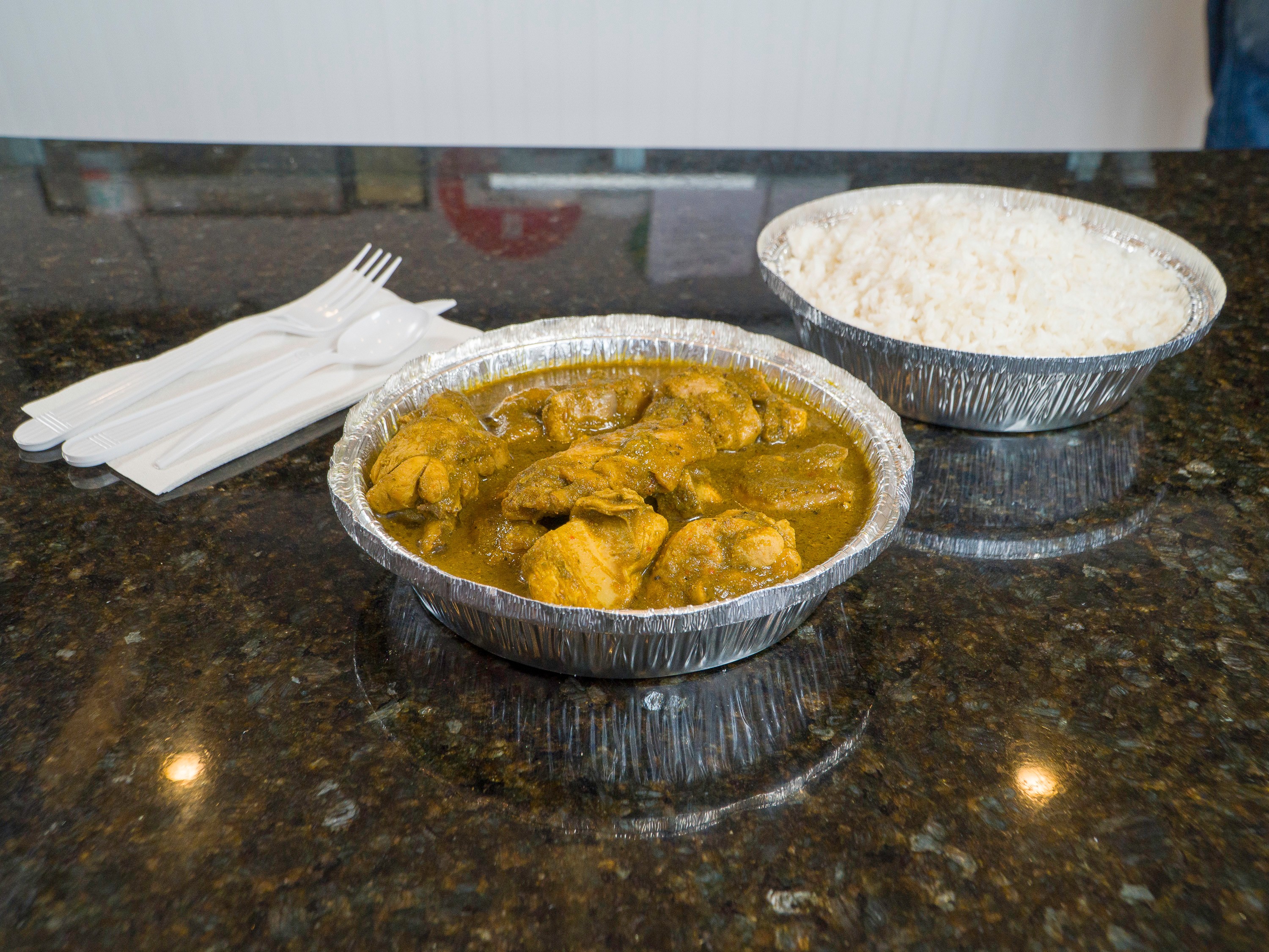 Order Jamaican Chicken Curry food online from Papa Curry store, Arlington on bringmethat.com