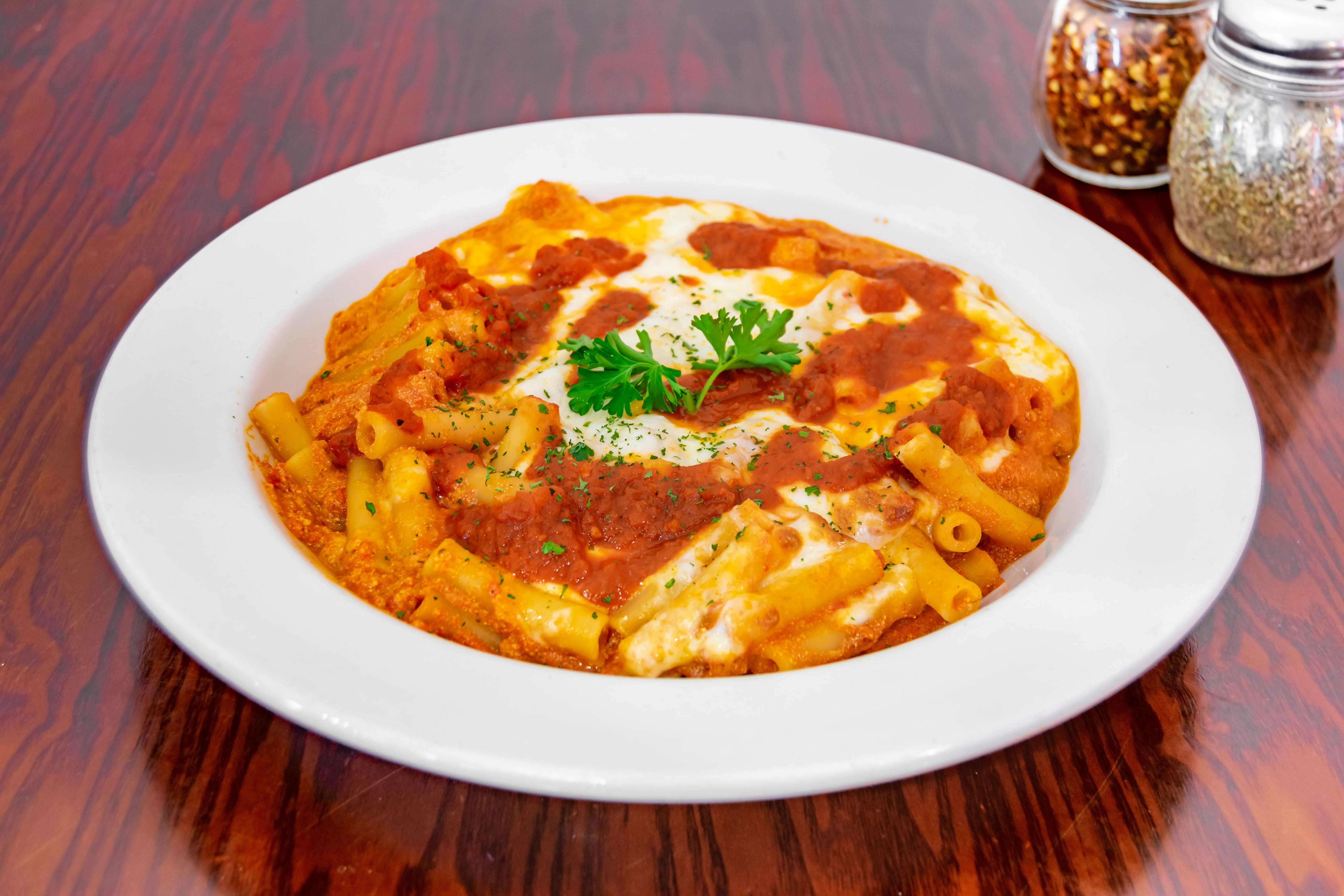 Order Baked Ziti - Dinner food online from Giovannis Pizzeria store, Levittown on bringmethat.com