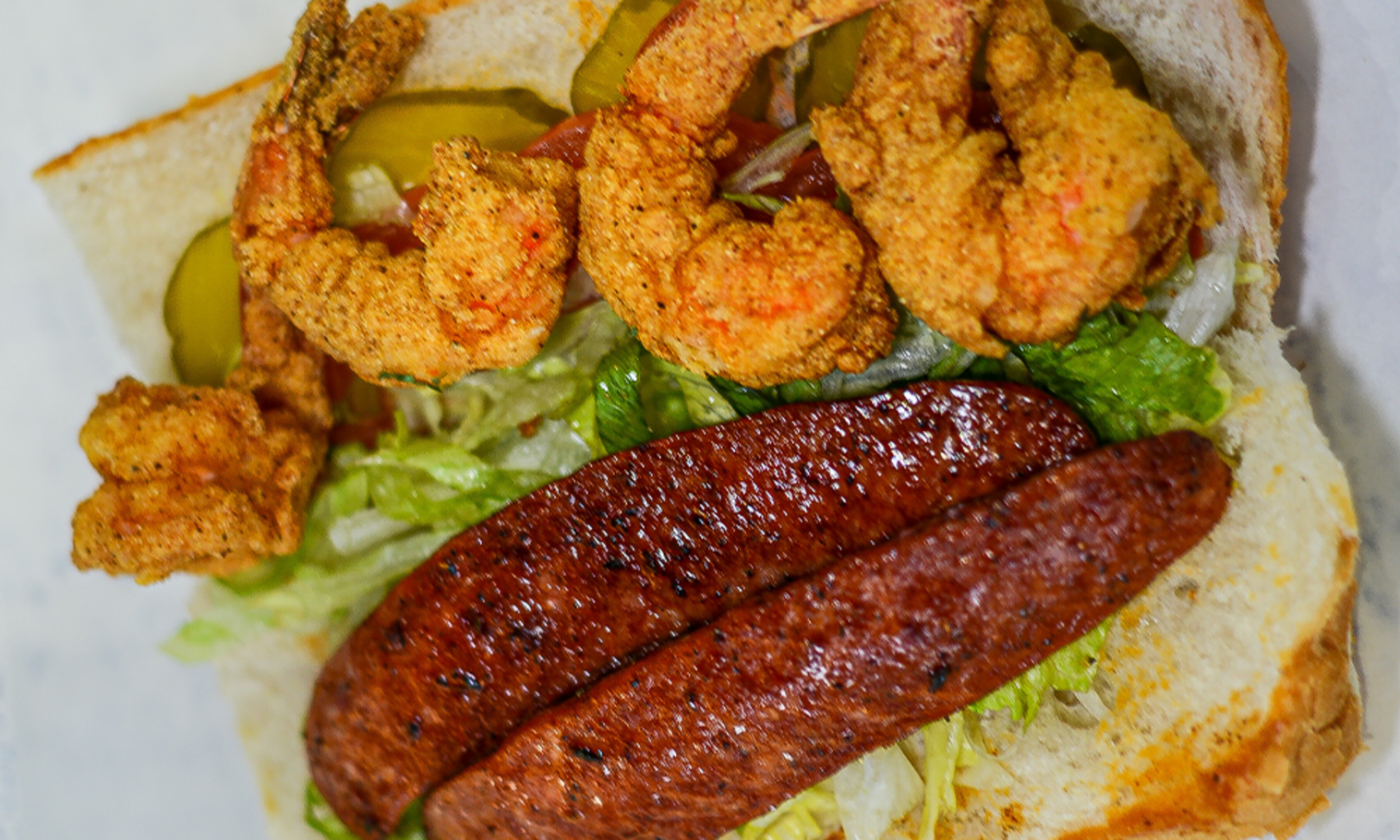 Order 8" Shrimp & Sausage Po-Boy food online from The Station Seafood Co. store, Houston on bringmethat.com
