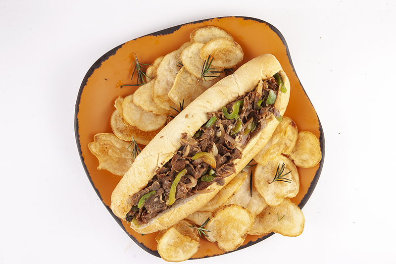 Order Philly Cheese Steak Supreme Sandwich food online from Napolies Pizza Kitchen store, Van Nuys on bringmethat.com