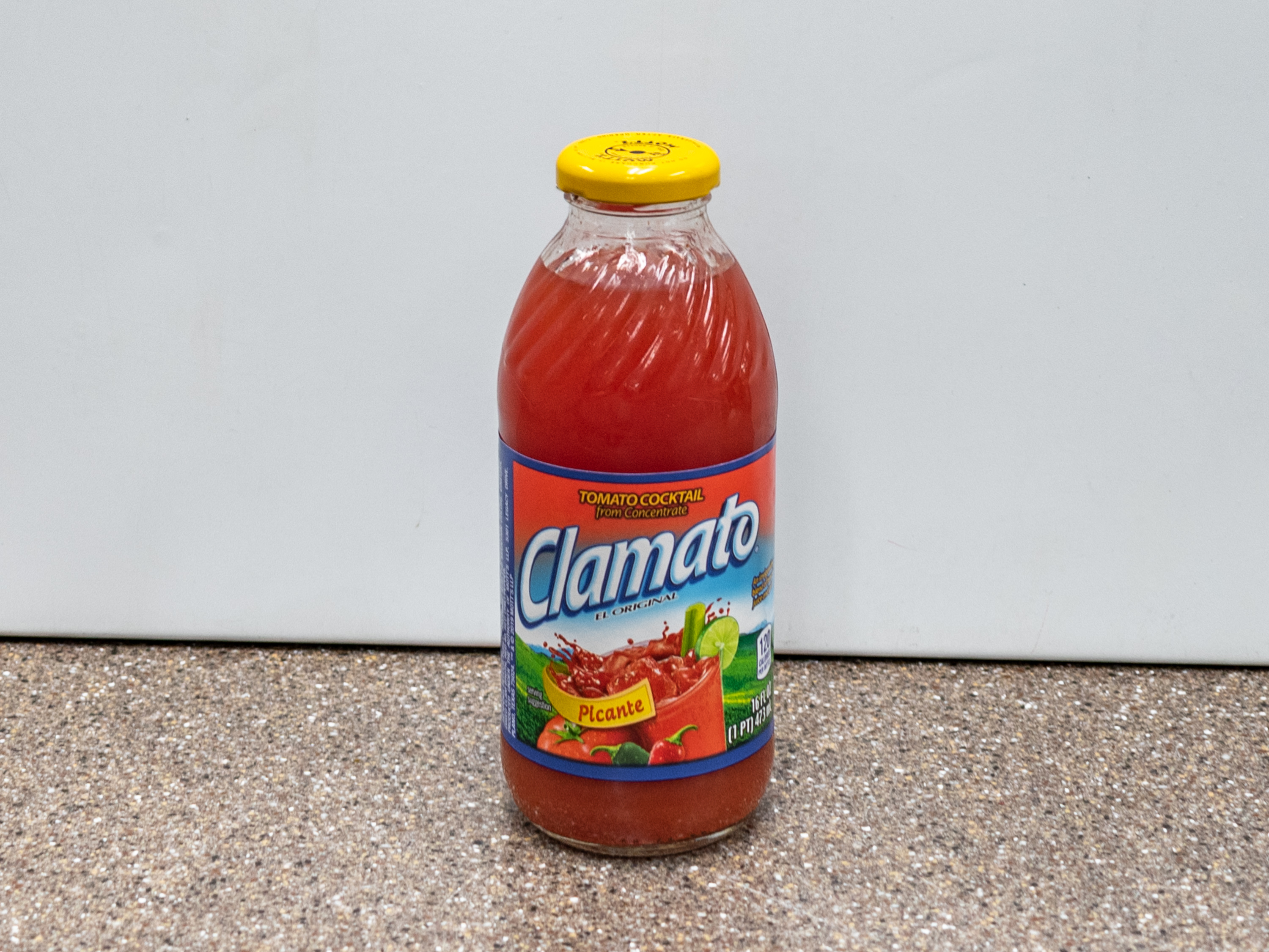 Order Clamato Picante 16 oz. food online from Kangaroo Food Mart store, Cathedral City on bringmethat.com