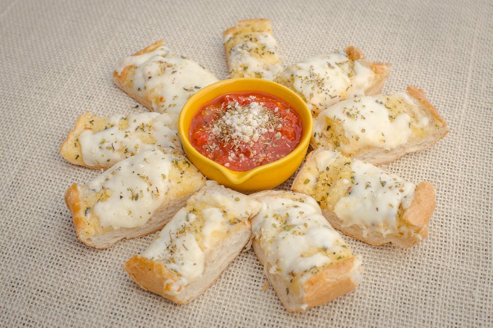 Order Garlic Bread with Cheese - Appetizer food online from La Casa De Pizzeria store, Troy on bringmethat.com