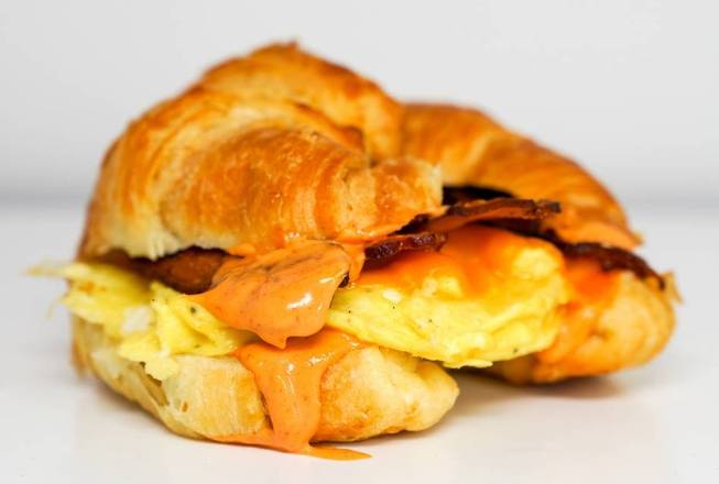 Order Croissant Bacon, Egg and Cheddar Sandwhich food online from Sunday Best Breakfast Sandwiches store, View Park-Windsor Hills on bringmethat.com