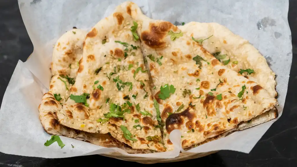 Order Garlic Naan  food online from Star Of India - Peachtree City store, Peachtree City on bringmethat.com