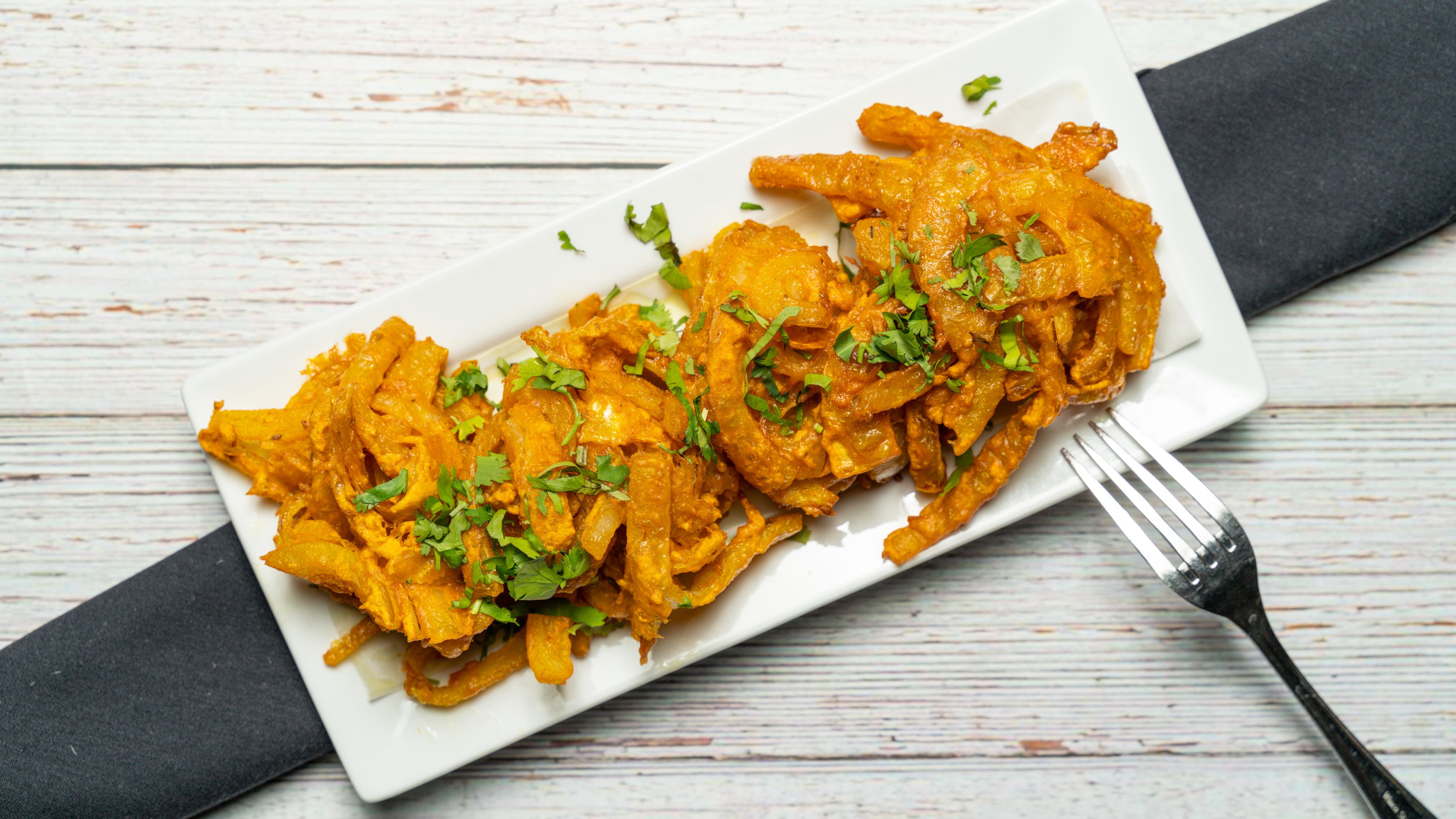 Order 14. Onion Bhaji food online from Bombay Cafe store, Wilton Manors on bringmethat.com