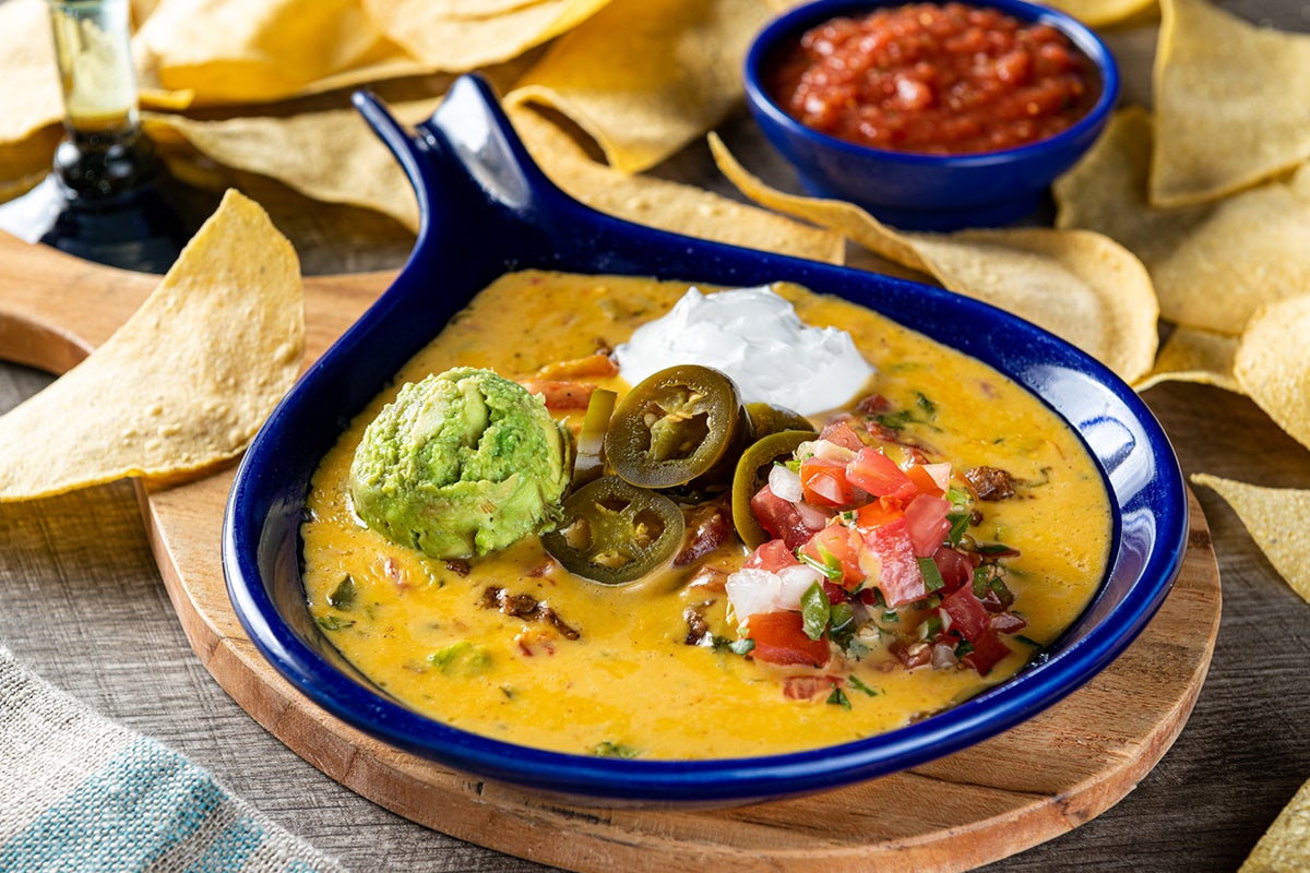 Order Campfire Queso food online from On The Border Mexican Grill and Cantina store, Colorado Springs on bringmethat.com
