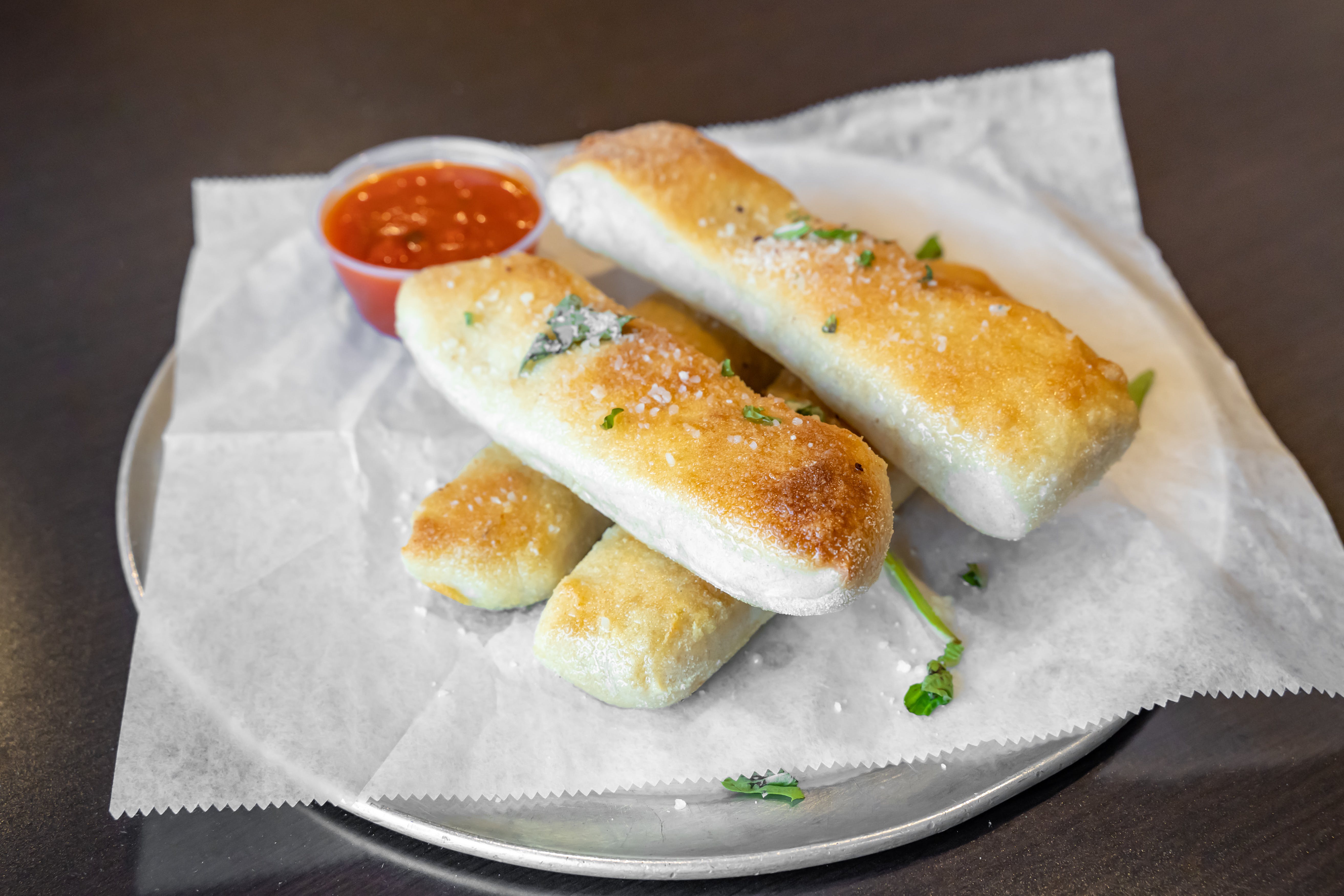 Order Homemade Breadsticks - 4 Pieces food online from Aldo & Manny Pizza & Pasta Ii store, Ridley Park on bringmethat.com