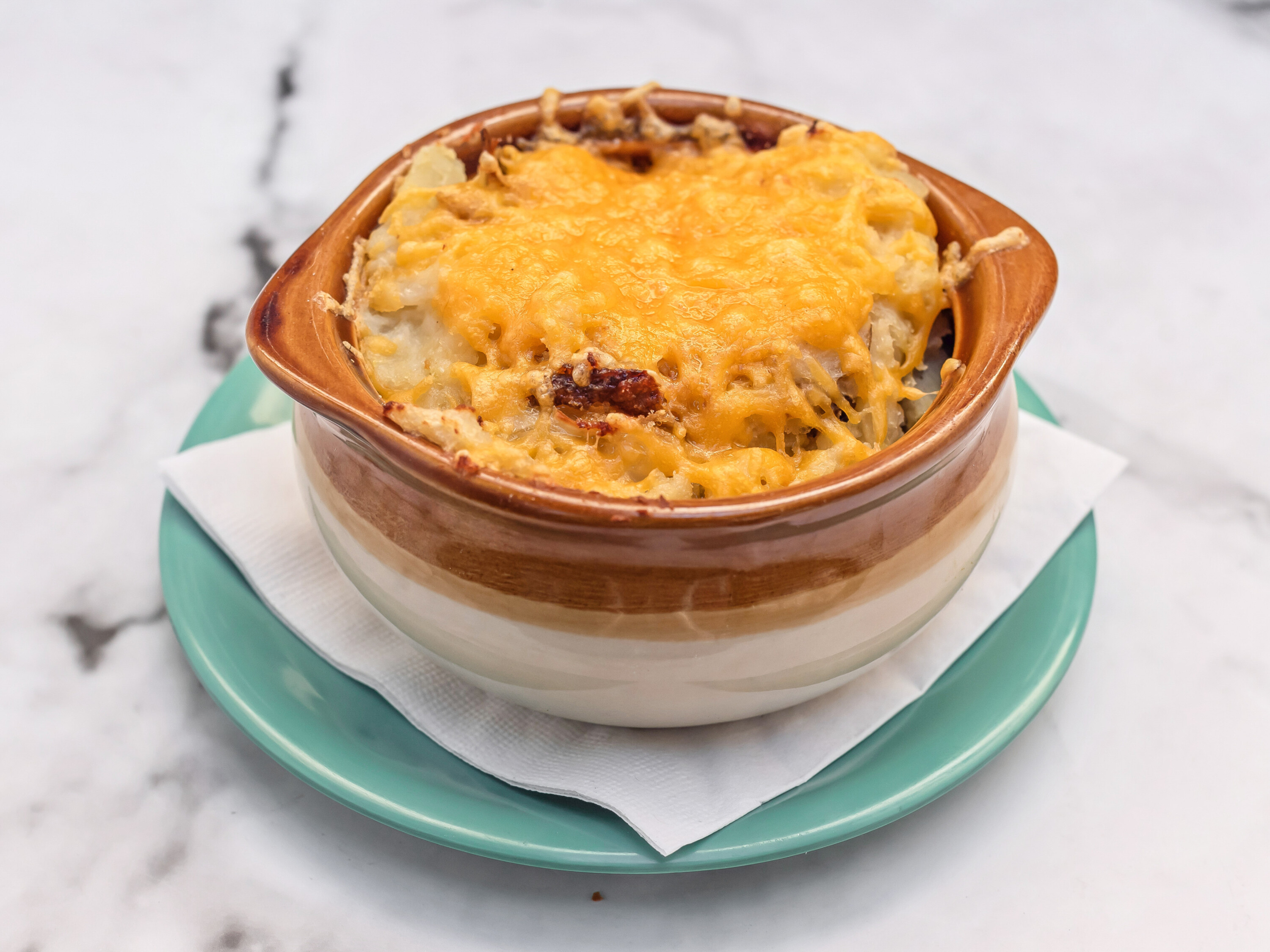 Order Oven-Baked Housemade Colcannon with Cheddar food online from Riley Pour House store, Carnegie on bringmethat.com
