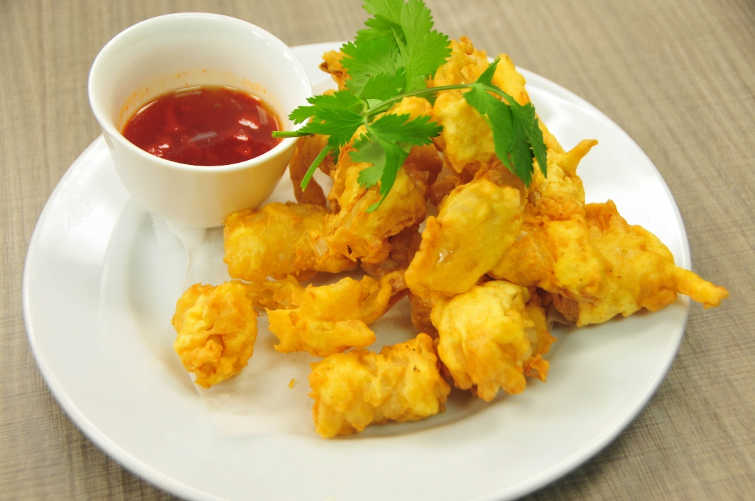 Order Fried Calamari food online from Saucy's Thai & Pho store, Plano on bringmethat.com