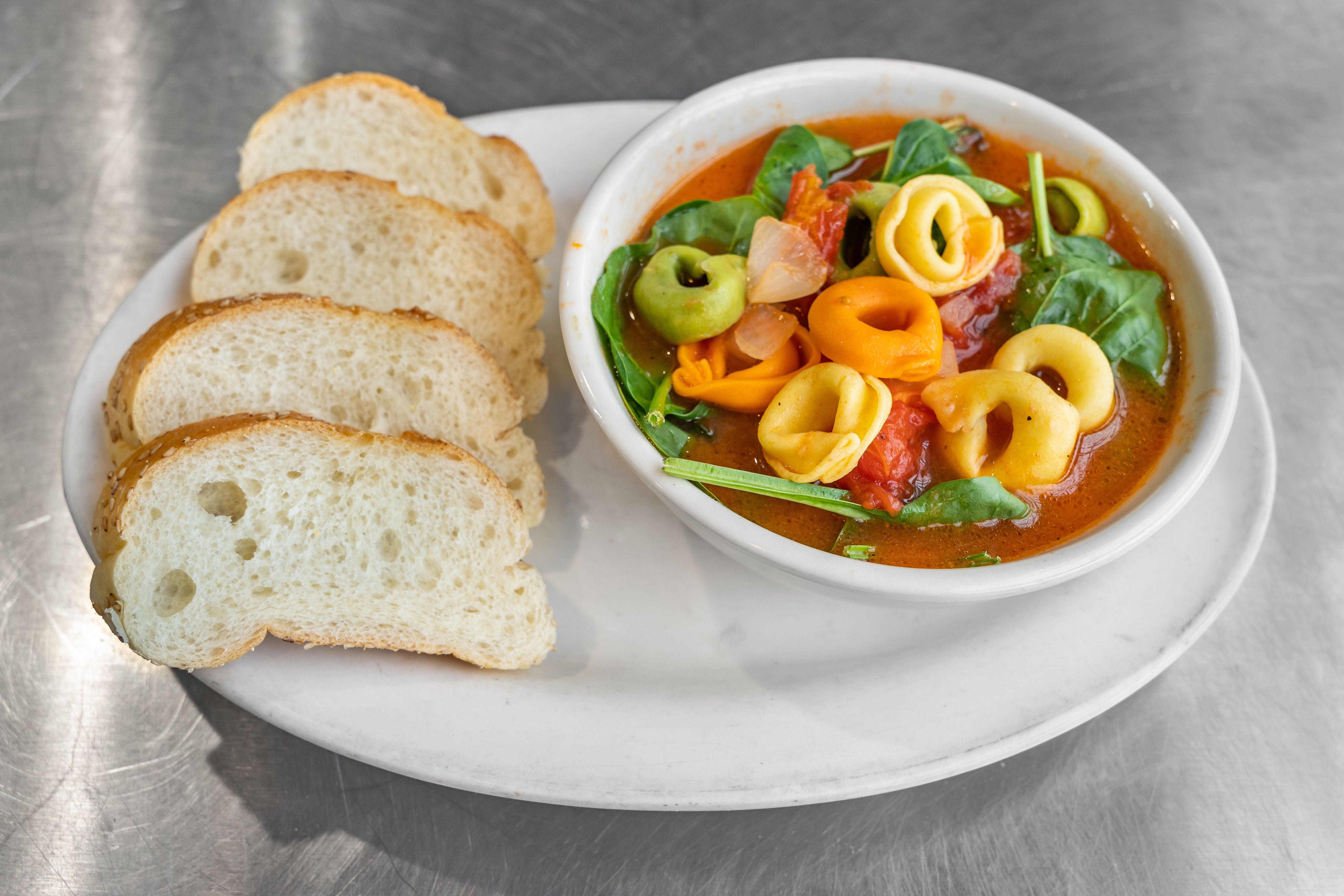 Order Spinach Tortellini Soup - Small food online from Melrose East Restaurant & Pizza store, Southampton on bringmethat.com